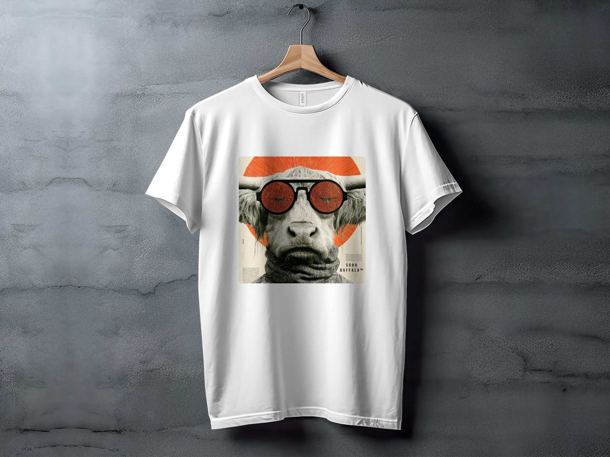 White t-shirt with graphic of cow wearing sunglasses and orange circle.