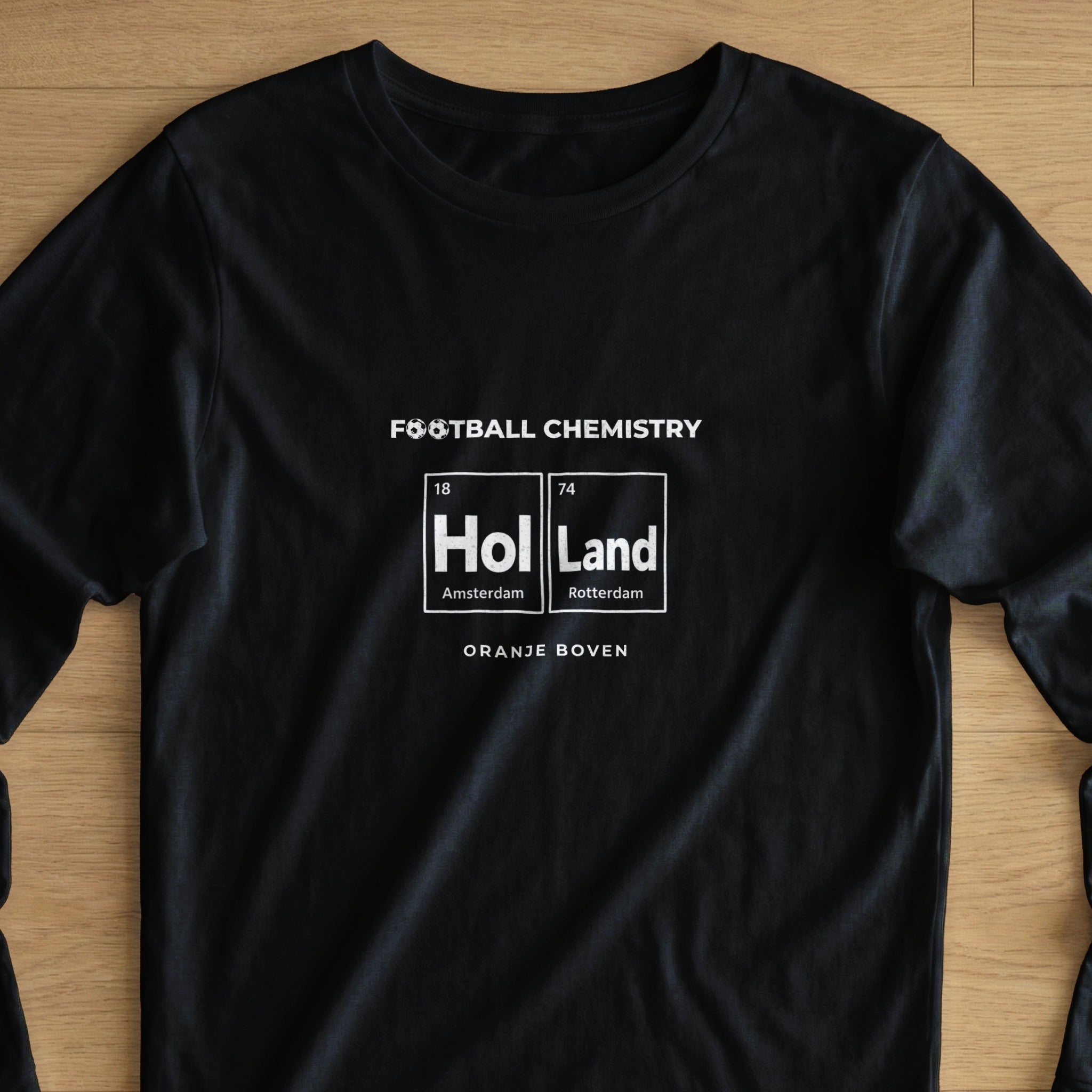 Black long-sleeved t-shirt with "Football Chemistry" and a periodic table element for Holland.