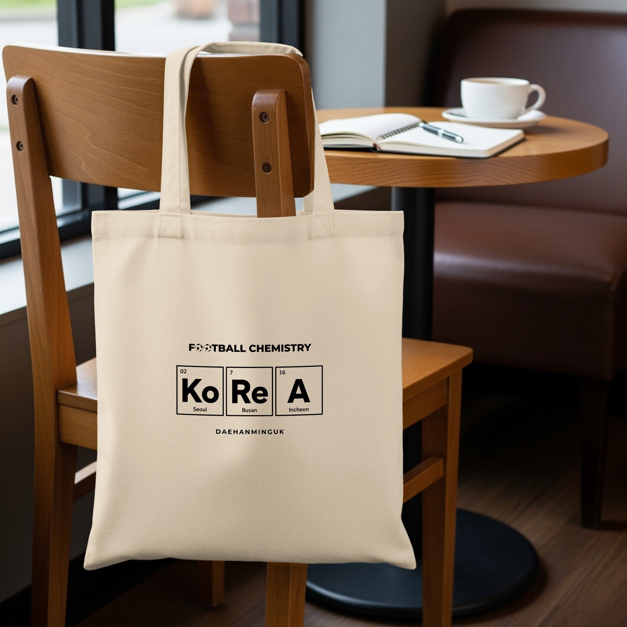 Cream canvas tote bag with "FOOTBALL CHEMISTRY KOREA" and periodic table elements.