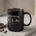 Black mug with "Football Chemistry USA" and periodic table elements representing cities.