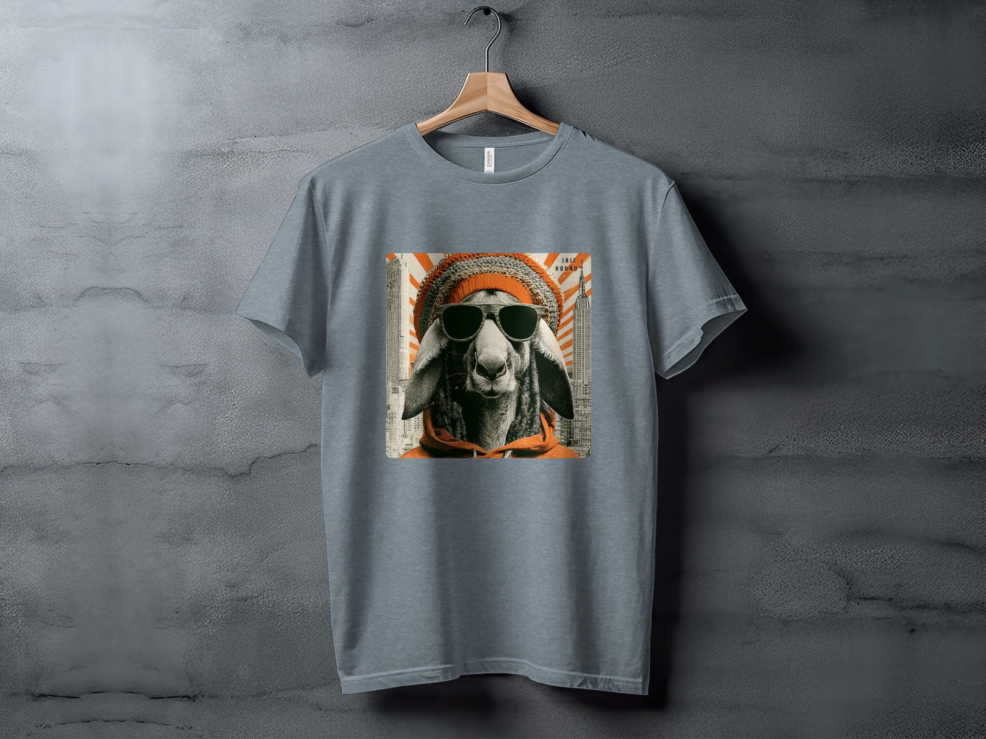 T-shirt with graphic of sheep wearing sunglasses and beanie in front of cityscape.