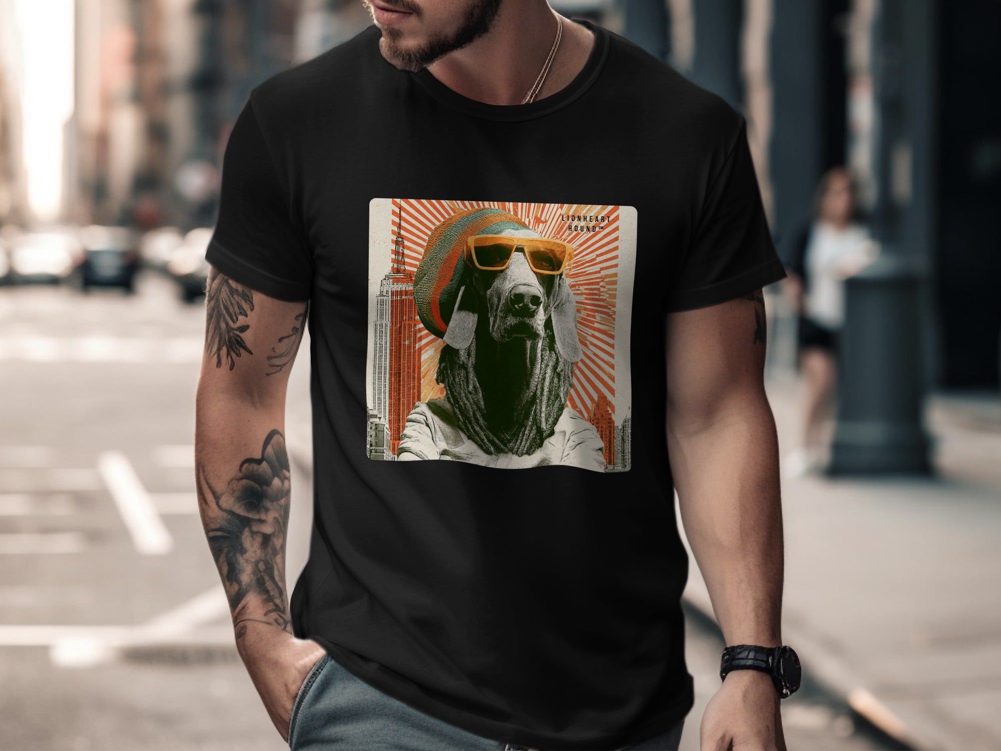 Man wearing a black t-shirt with a graphic of a dog in sunglasses and a hat.