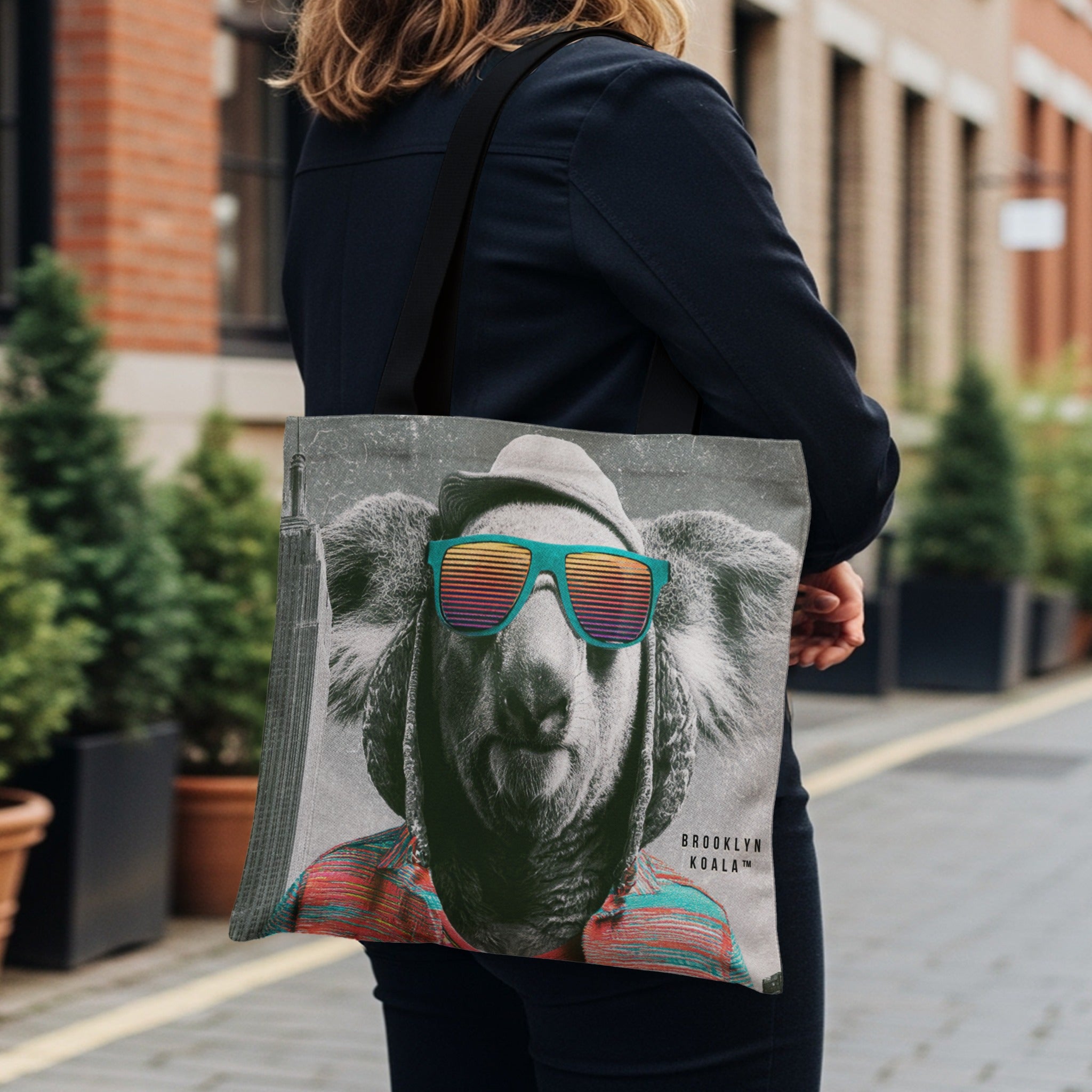 Tote bag with vintage koala wearing sunglasses and striped shirt.