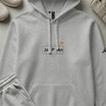 Gray Adidas hoodie with "JAPAN" text and periodic table elements.