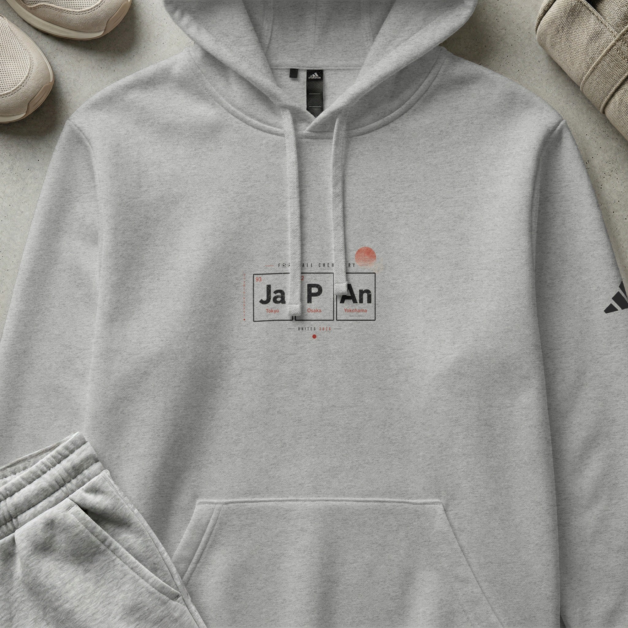 Gray Adidas hoodie with "JAPAN" text and periodic table elements.