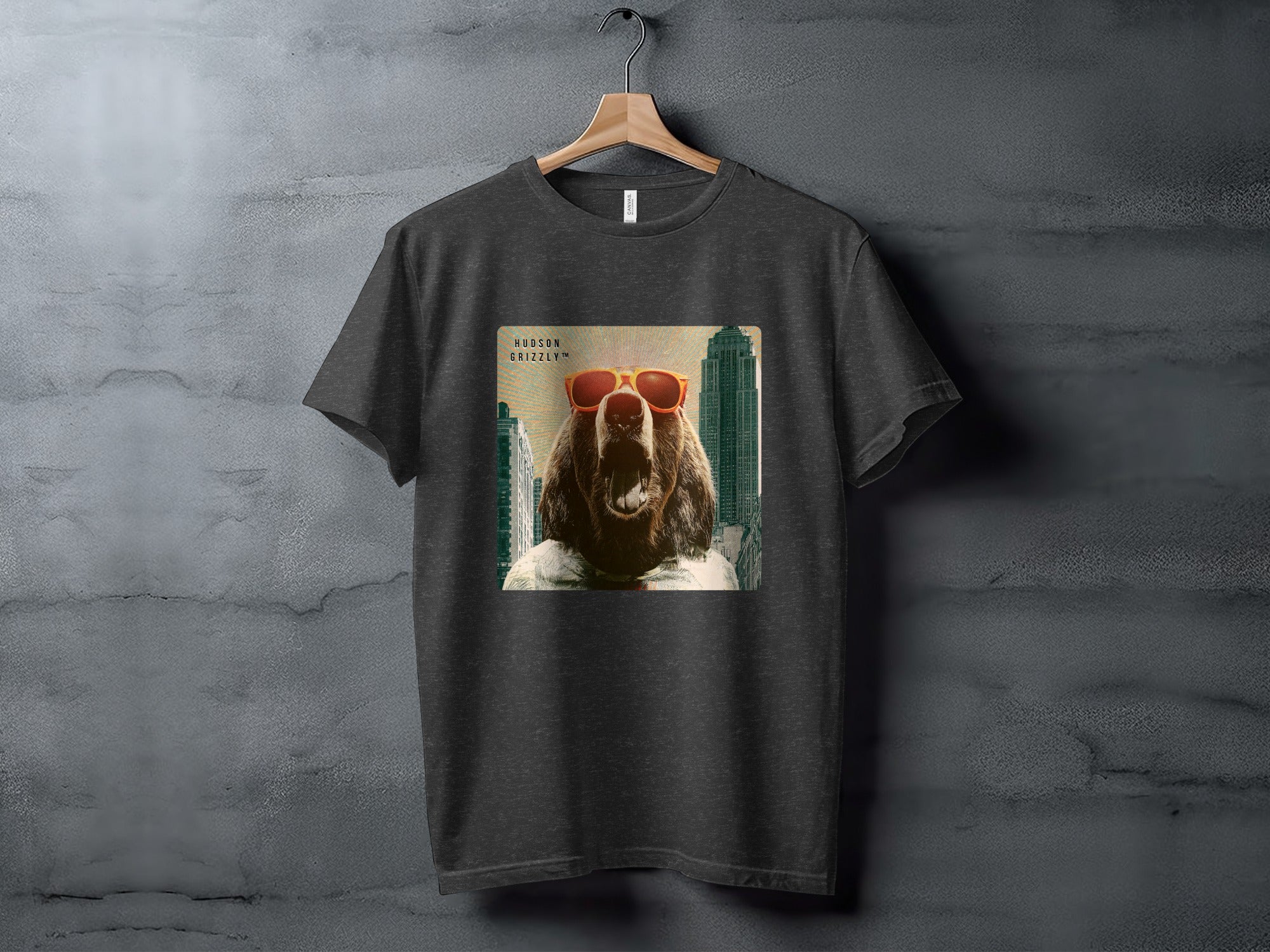 T-shirt featuring a grizzly bear wearing sunglasses and a shirt, superimposed on a city skyline.