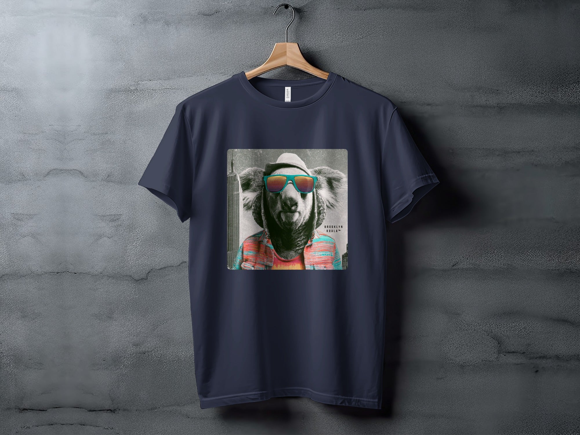 T-shirt featuring a colorful graphic of a koala wearing sunglasses and a hat.