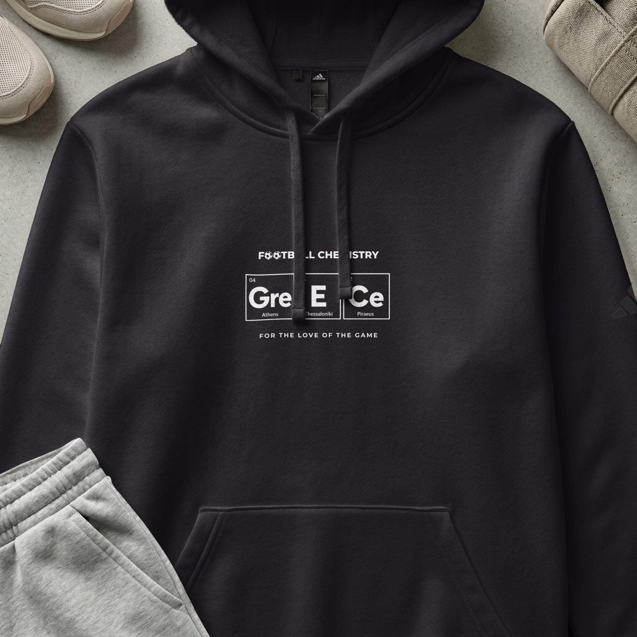 Black hoodie with "FOOTBL CHEMISTRY" and "Greece" periodic table design.