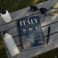 Spiral notebook with "Italia Azzurri" and Roman Colosseum design.
