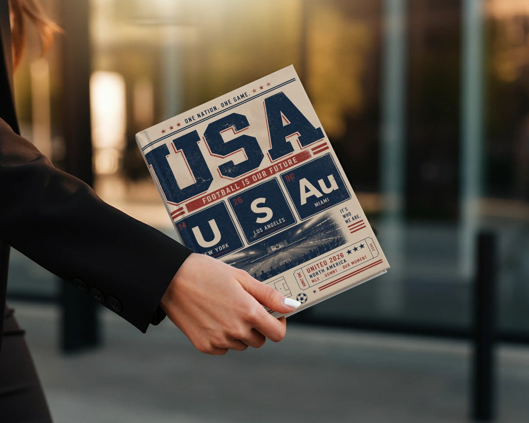 Newspaper titled "USA FOOTBALL IS OUR FUTURE" with city names and "UNITED 2026".