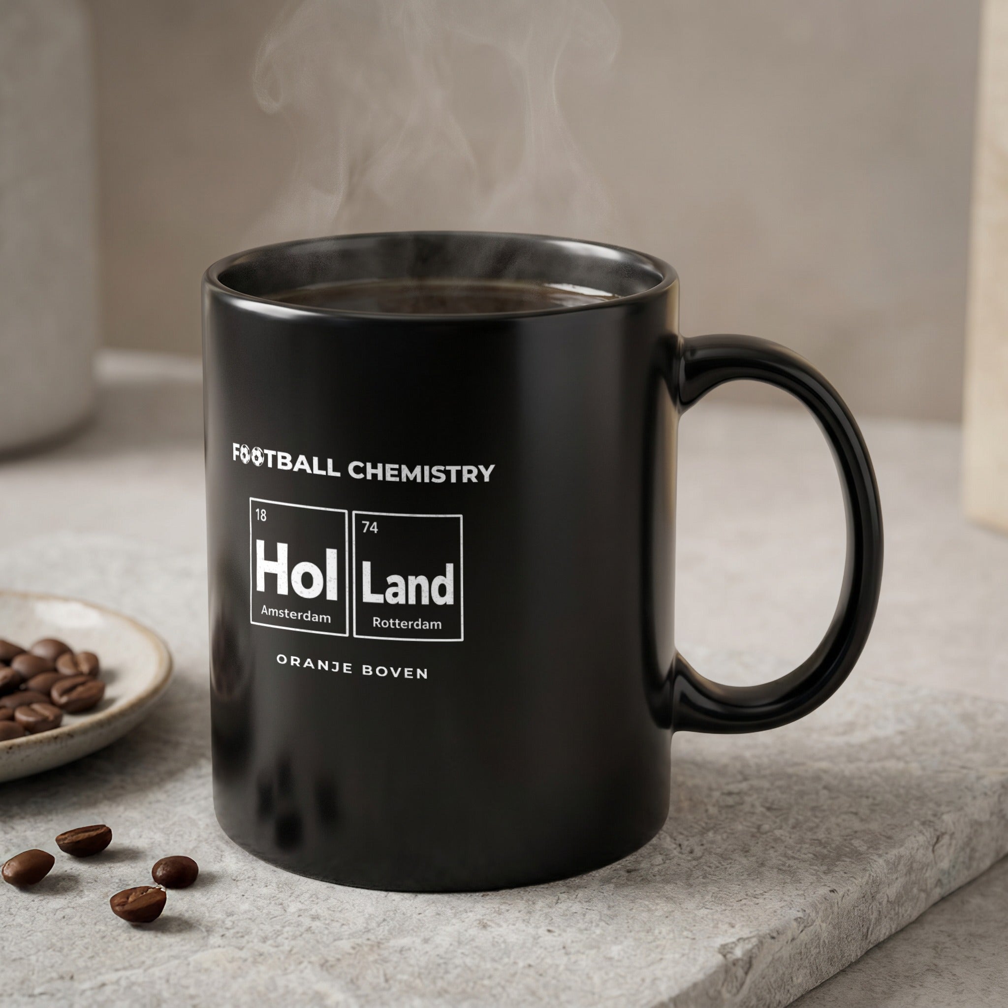 Black mug with "FOOTBALL CHEMISTRY" and "Hol Land" with locations and ORANJE BOVEN.