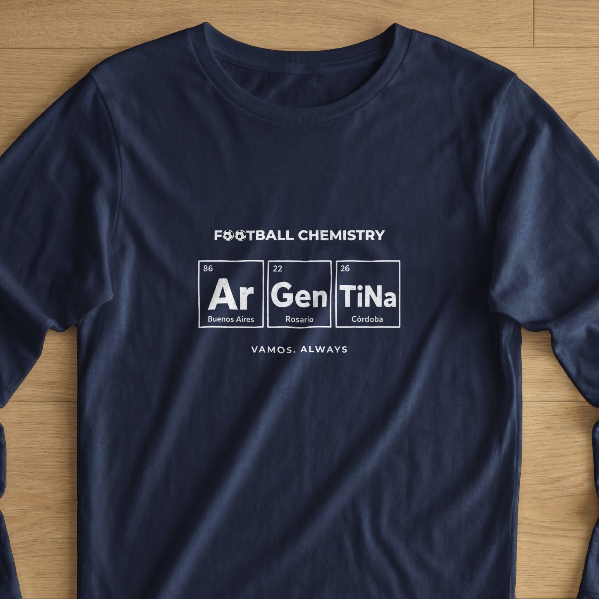 Navy t-shirt with "FOOTBALL CHEMISTRY Ar Gen TiNa" graphic and locations.