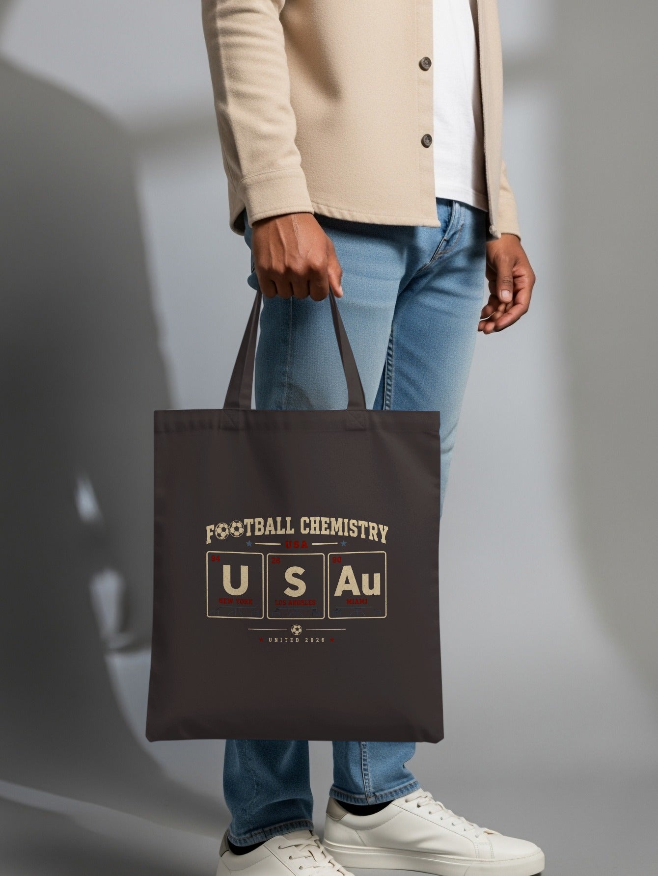 Tote bag with "Football Chemistry USA Au" text and periodic table elements.
