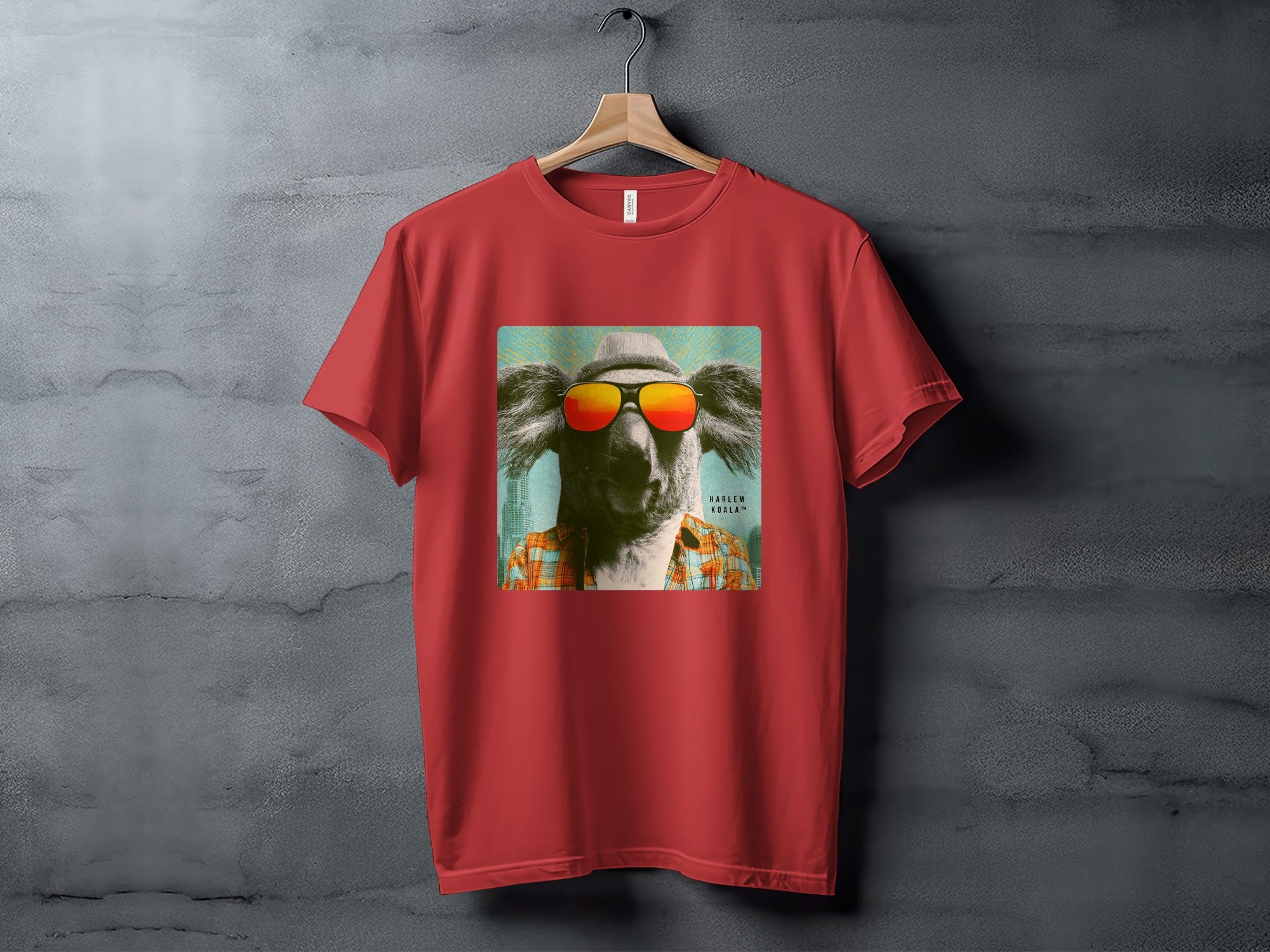 Red t-shirt with a graphic of a koala wearing sunglasses and a plaid shirt.