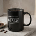 Black mug with "Football Chemistry" and periodic table elements, next to coffee beans.