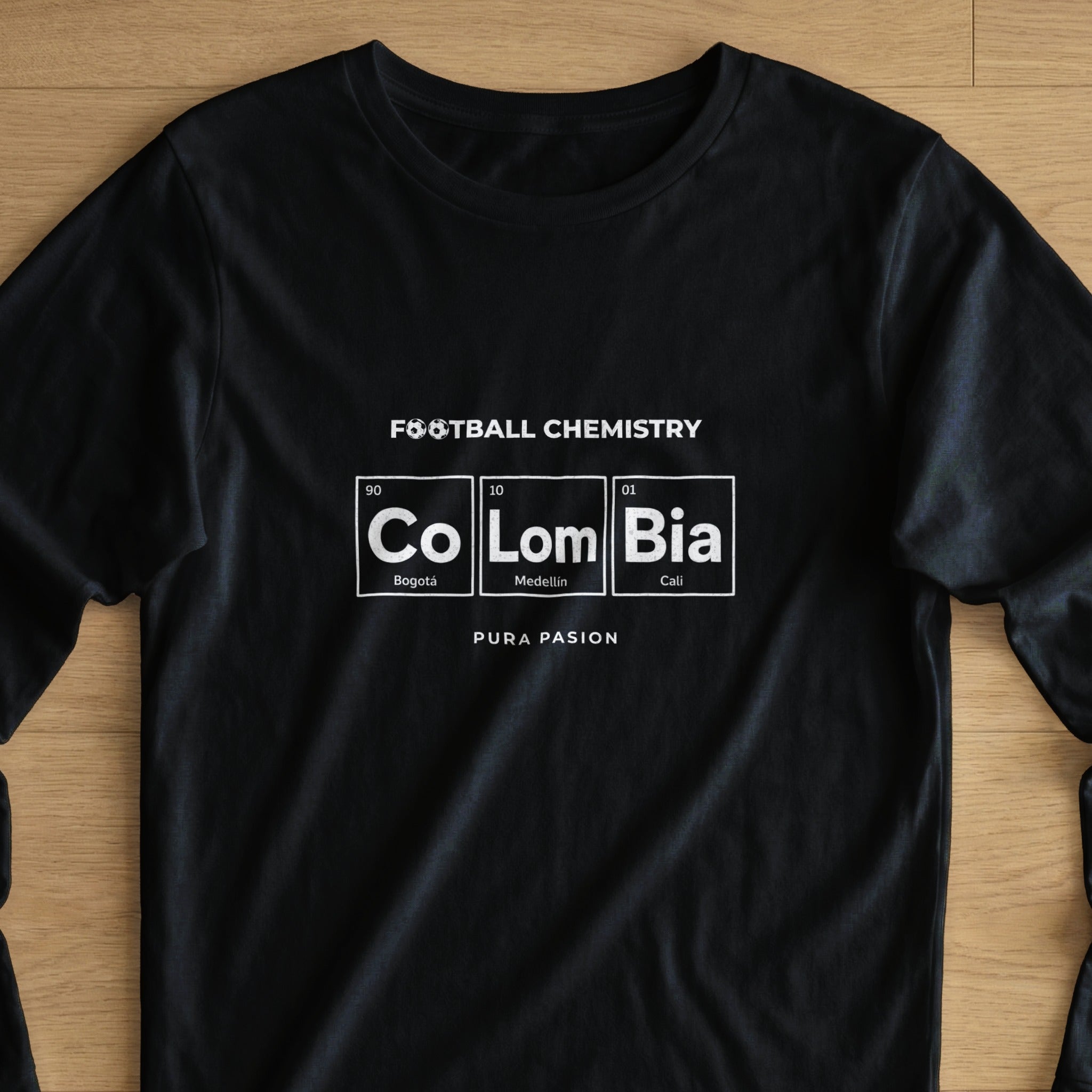 Black t-shirt with "Football Chemistry Colombia" in periodic table style.