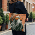Tote bag with illustration of a dog in sunglasses and hat, with "Sunrise Hound" text.