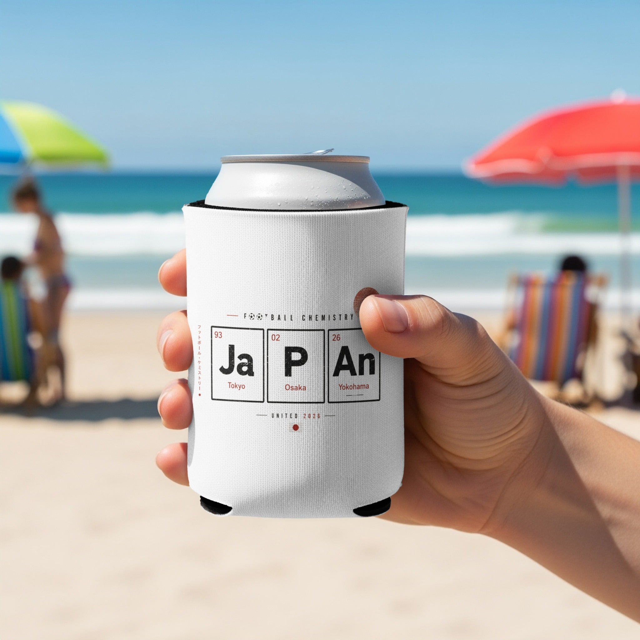 White can cooler with "JAPAN" in periodic table style, held by a hand.