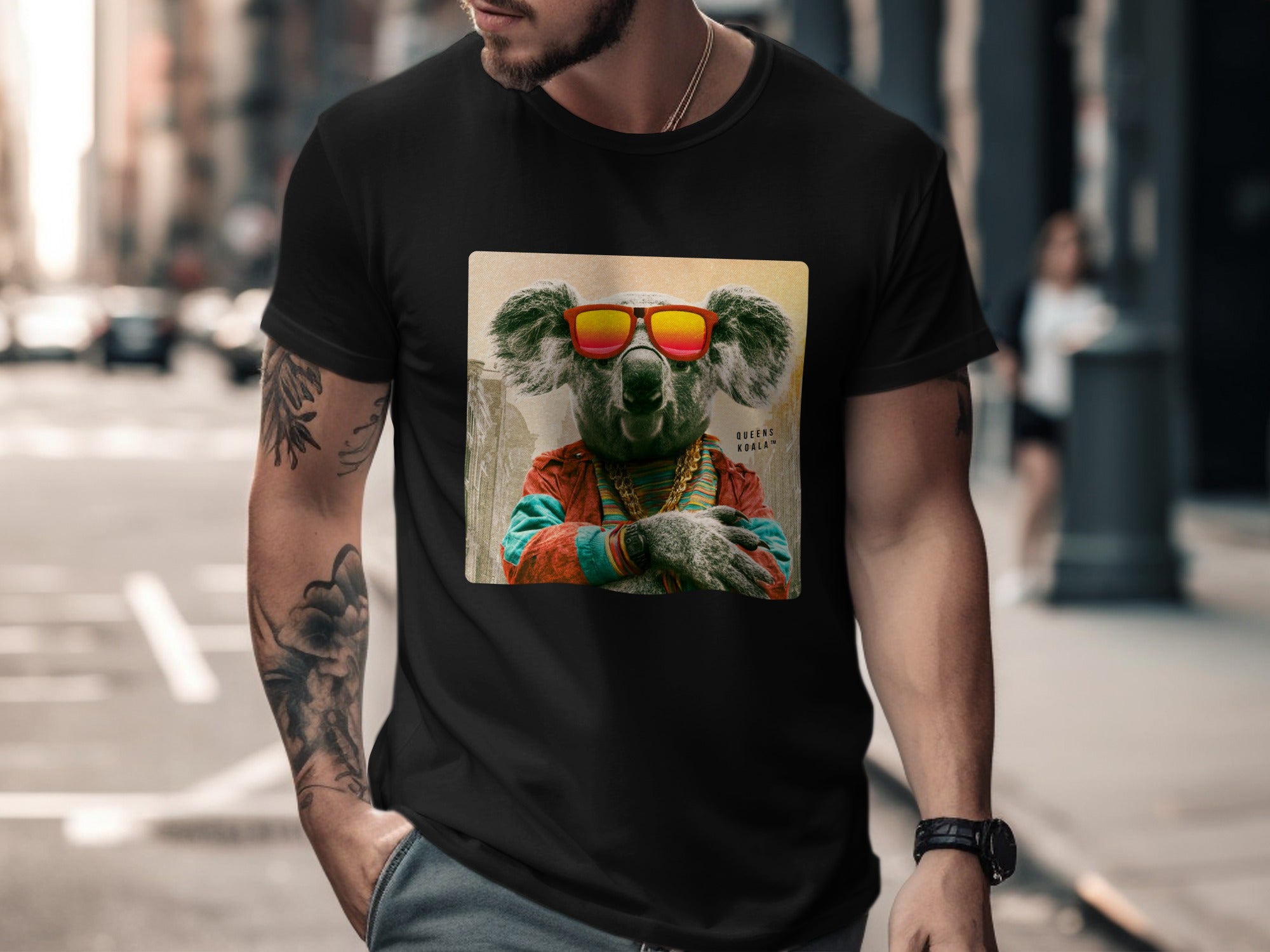Koala wearing sunglasses and chain on black t-shirt.