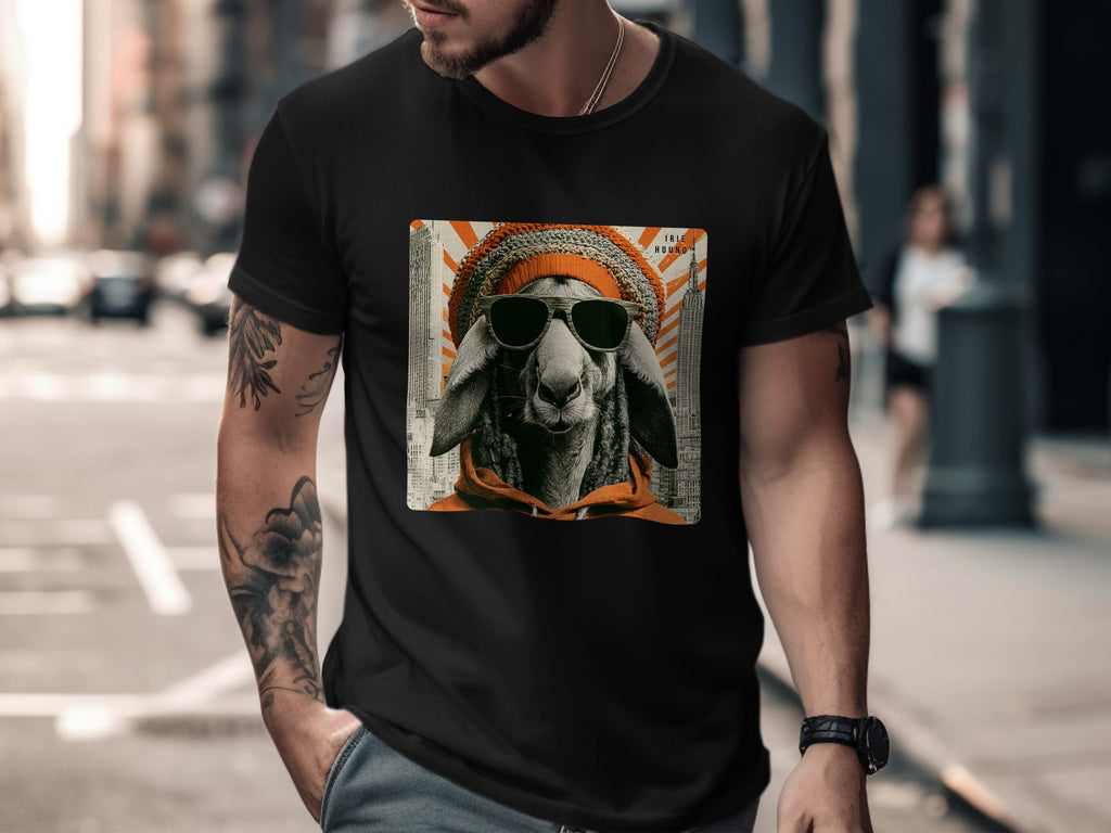 Man in black t-shirt wearing sunglasses and orange beanie with sheep graphic.