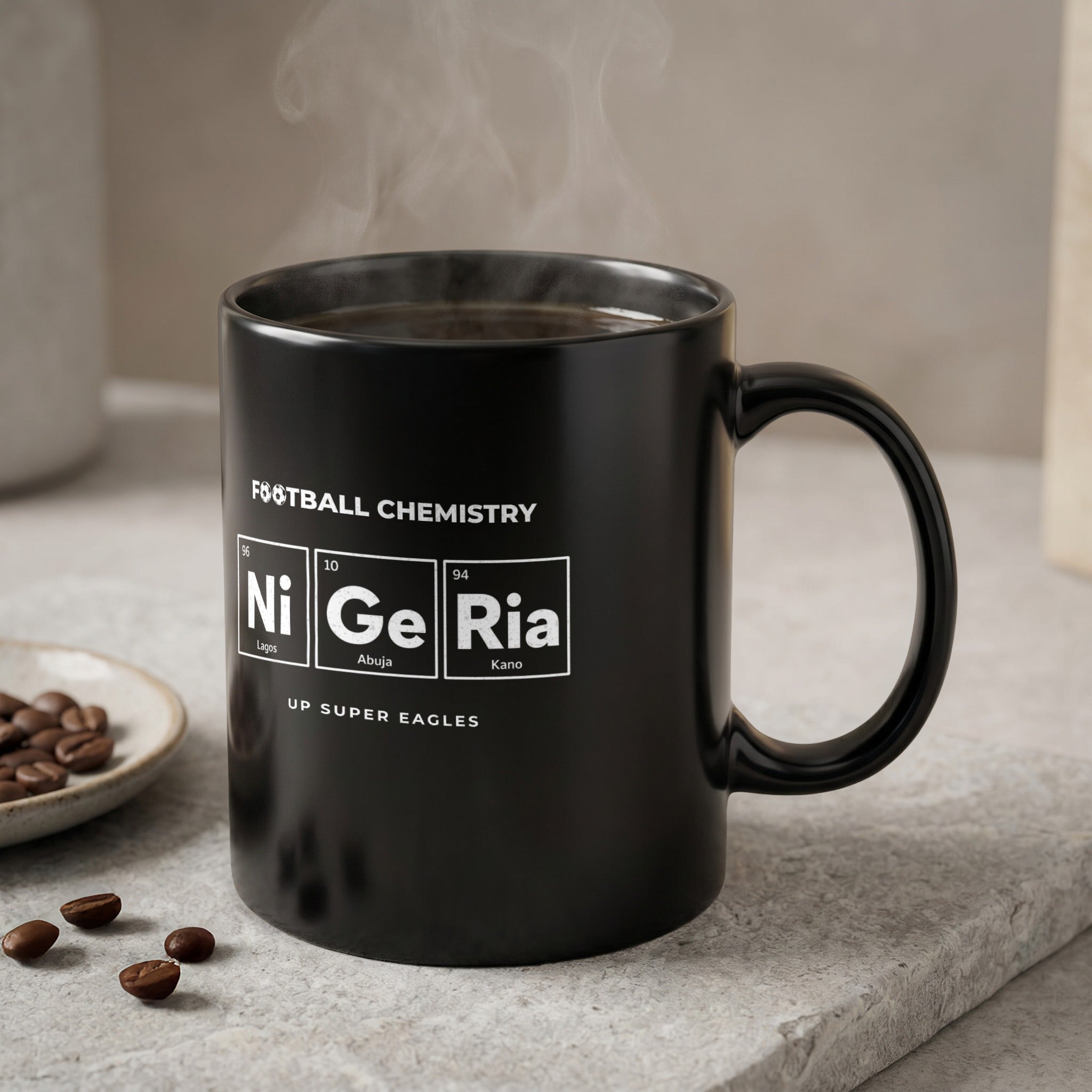Black mug with "FOOTBALL CHEMISTRY" and "Ni Ge Ria" in periodic table style.