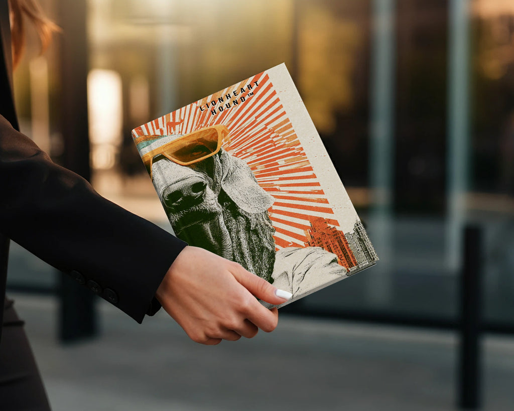 Woman holding magazine with lion wearing sunglasses and "Lionheart Hound" text.