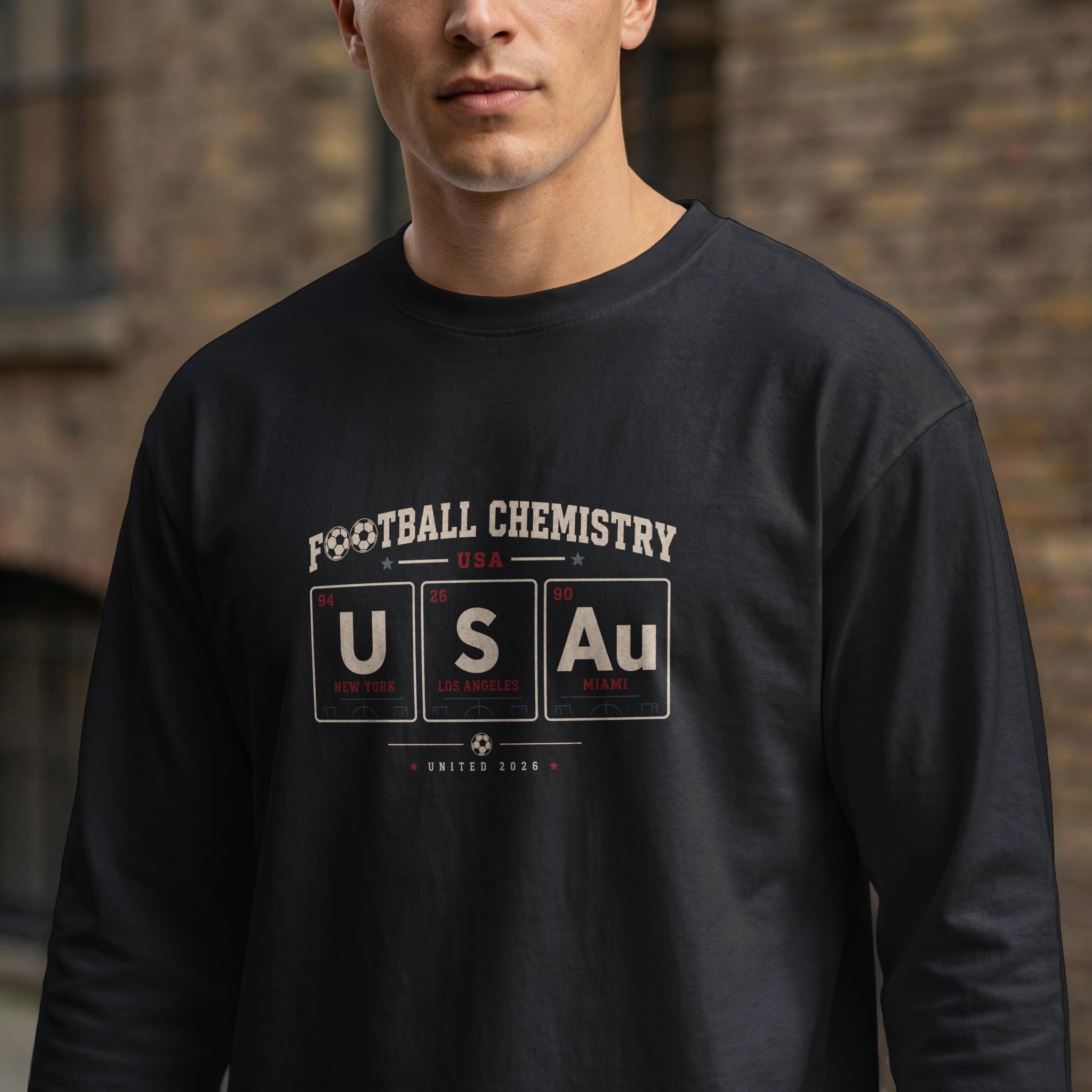 Black long-sleeve shirt with "Football Chemistry USA" and periodic table elements.