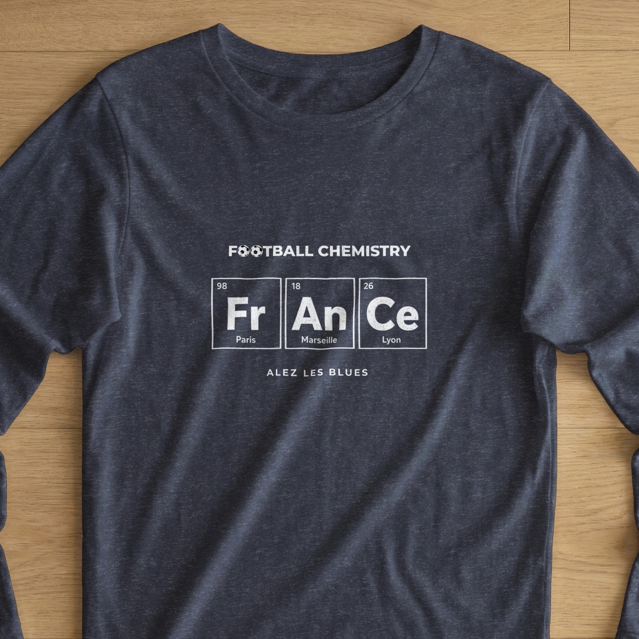 Dark t-shirt with "FR AN Ce" in a periodic table design, "FOOTBALL CHEMISTRY" above.