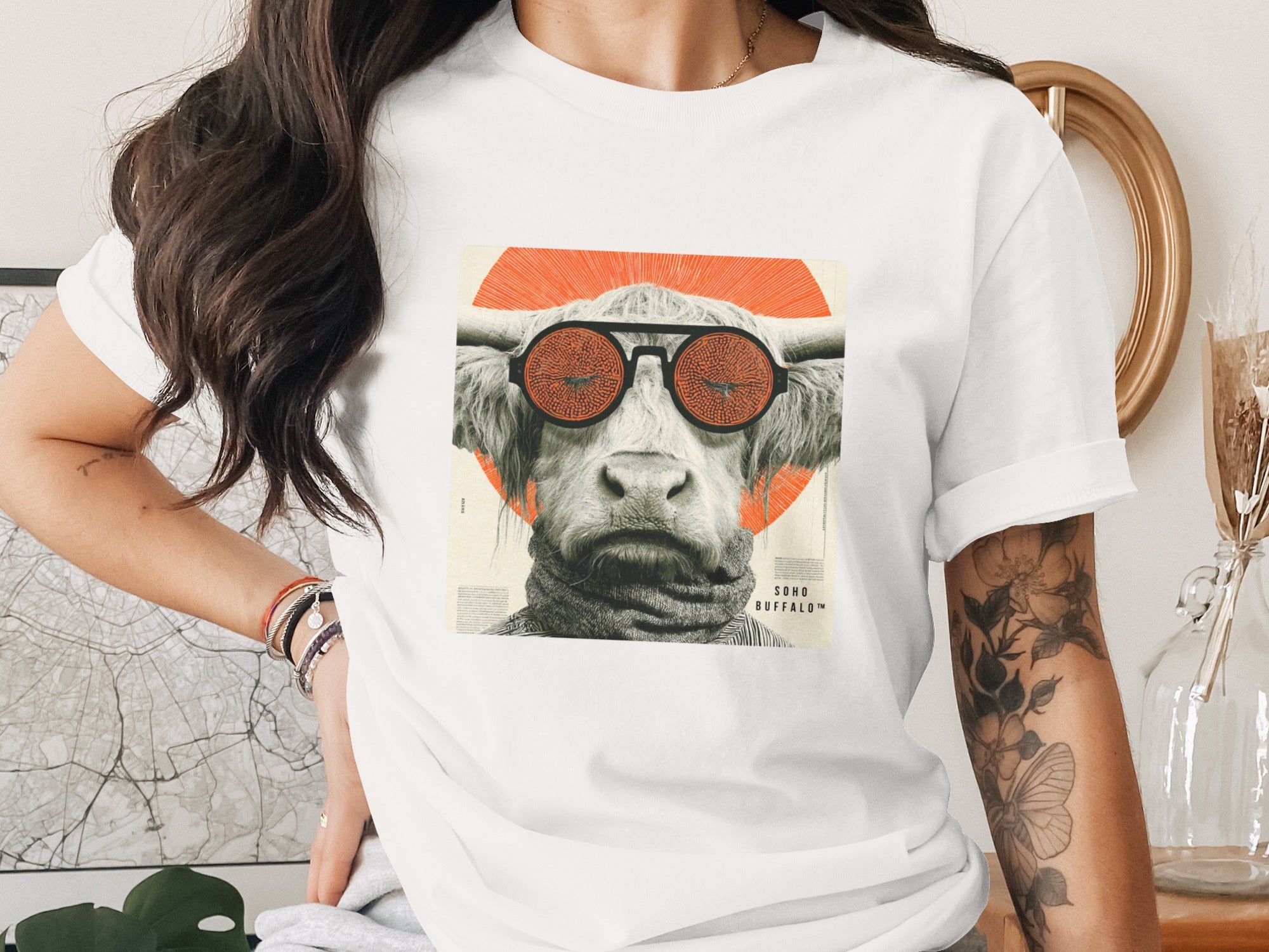 White t-shirt with graphic of a bull wearing sunglasses and a turtleneck.