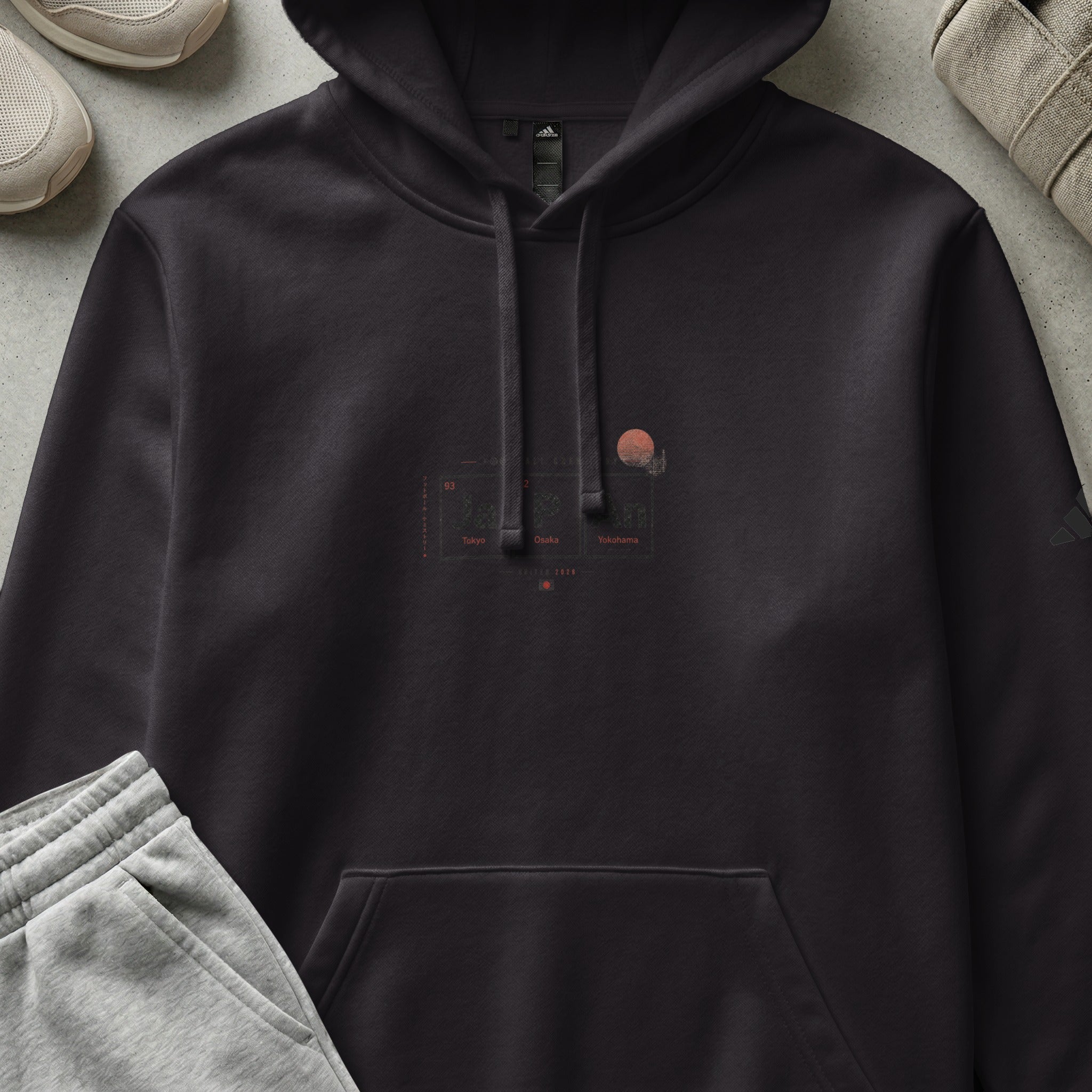 Dark hoodie with "Tokyo, Osaka" text and cityscape graphic.