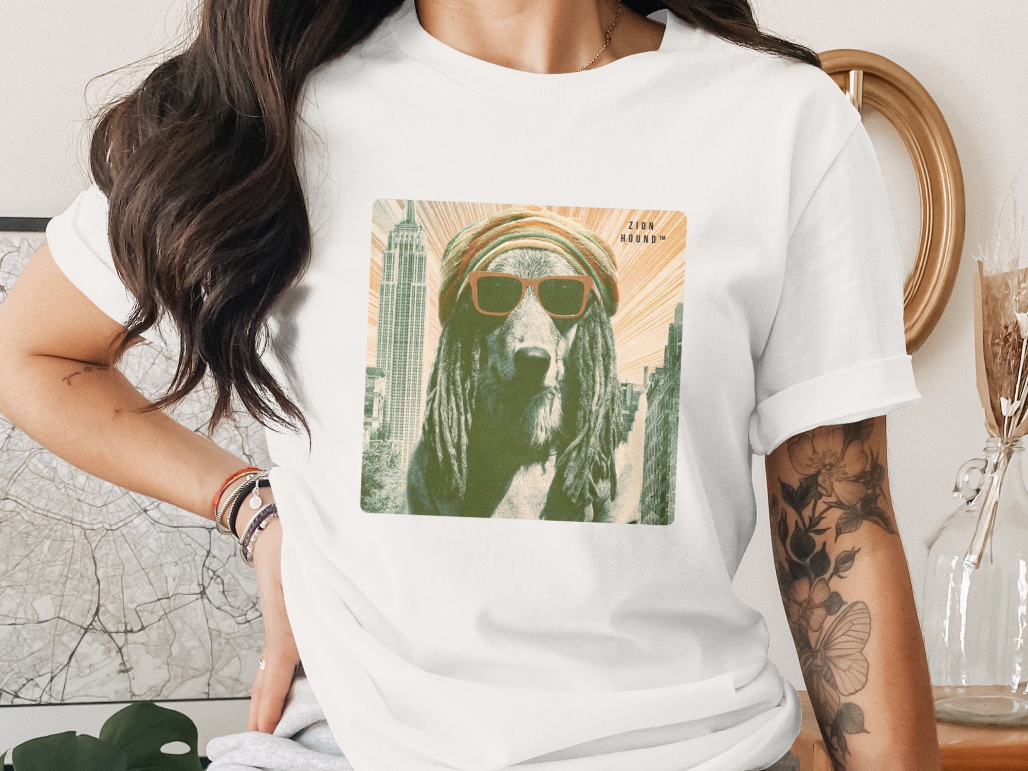 T-shirt graphic of a dog in sunglasses and a turban with Empire State Building in background.