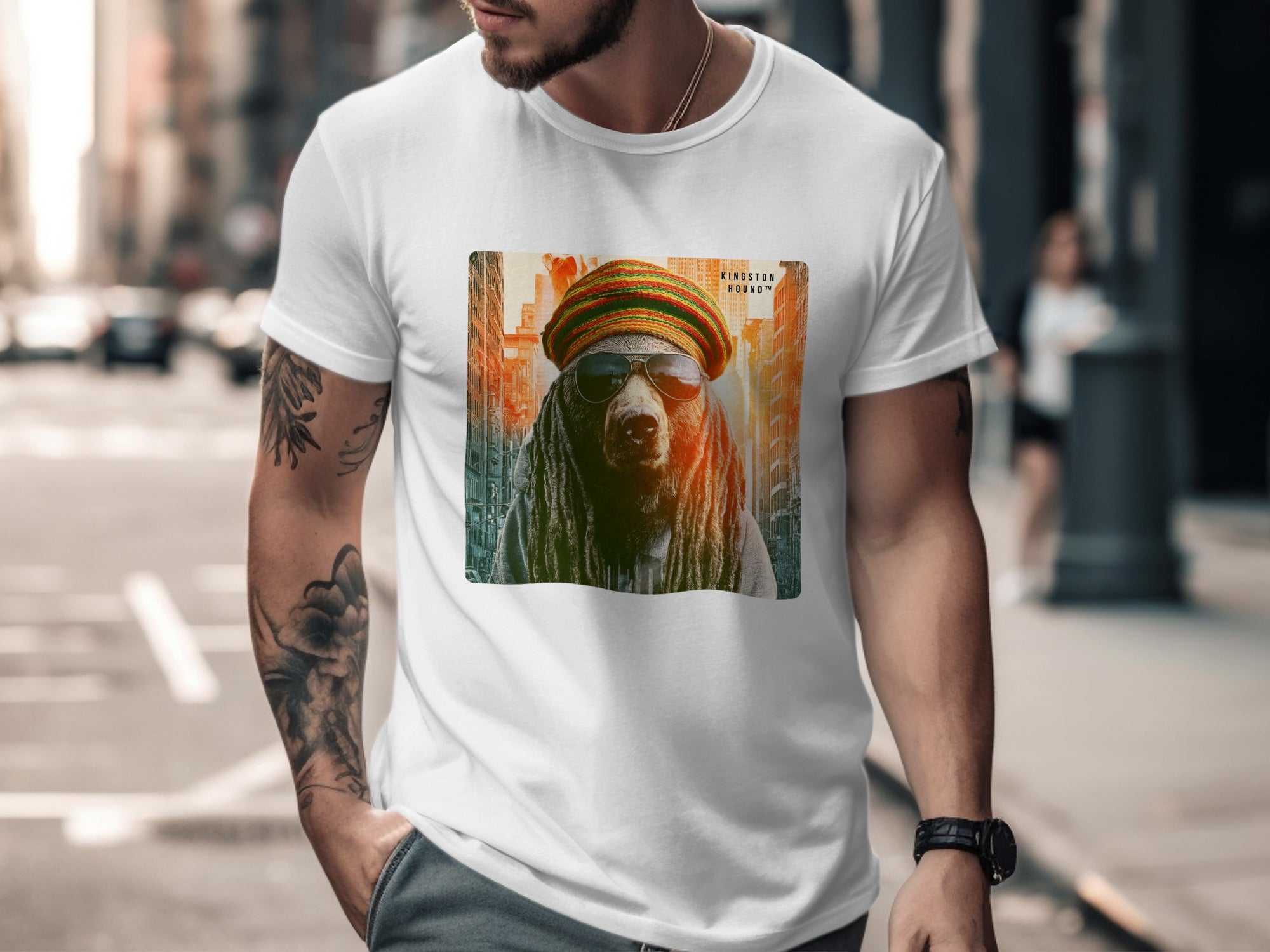 Man wearing white t-shirt featuring a bear in sunglasses and a beanie.