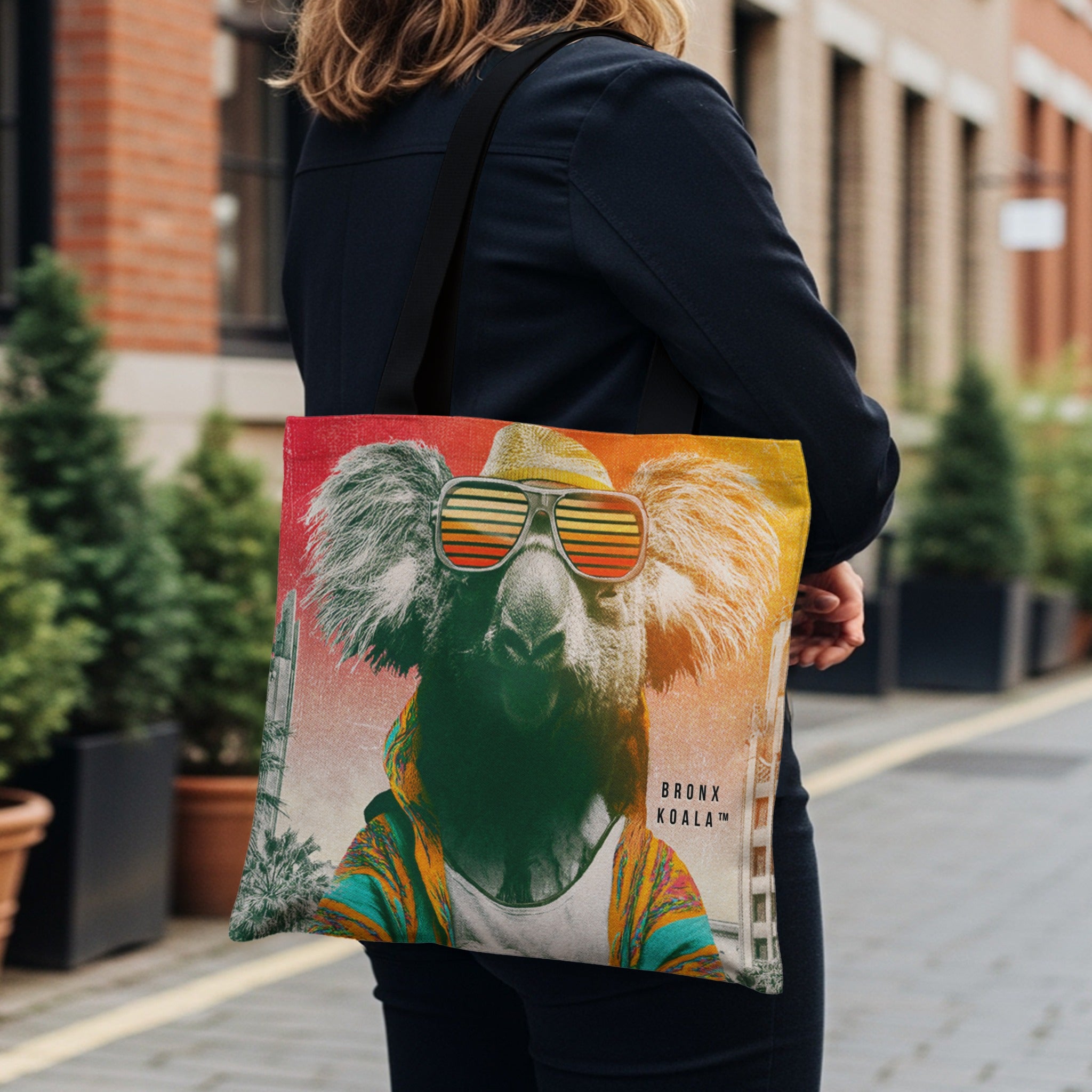 Tote bag with a colorful koala wearing sunglasses and a jacket.