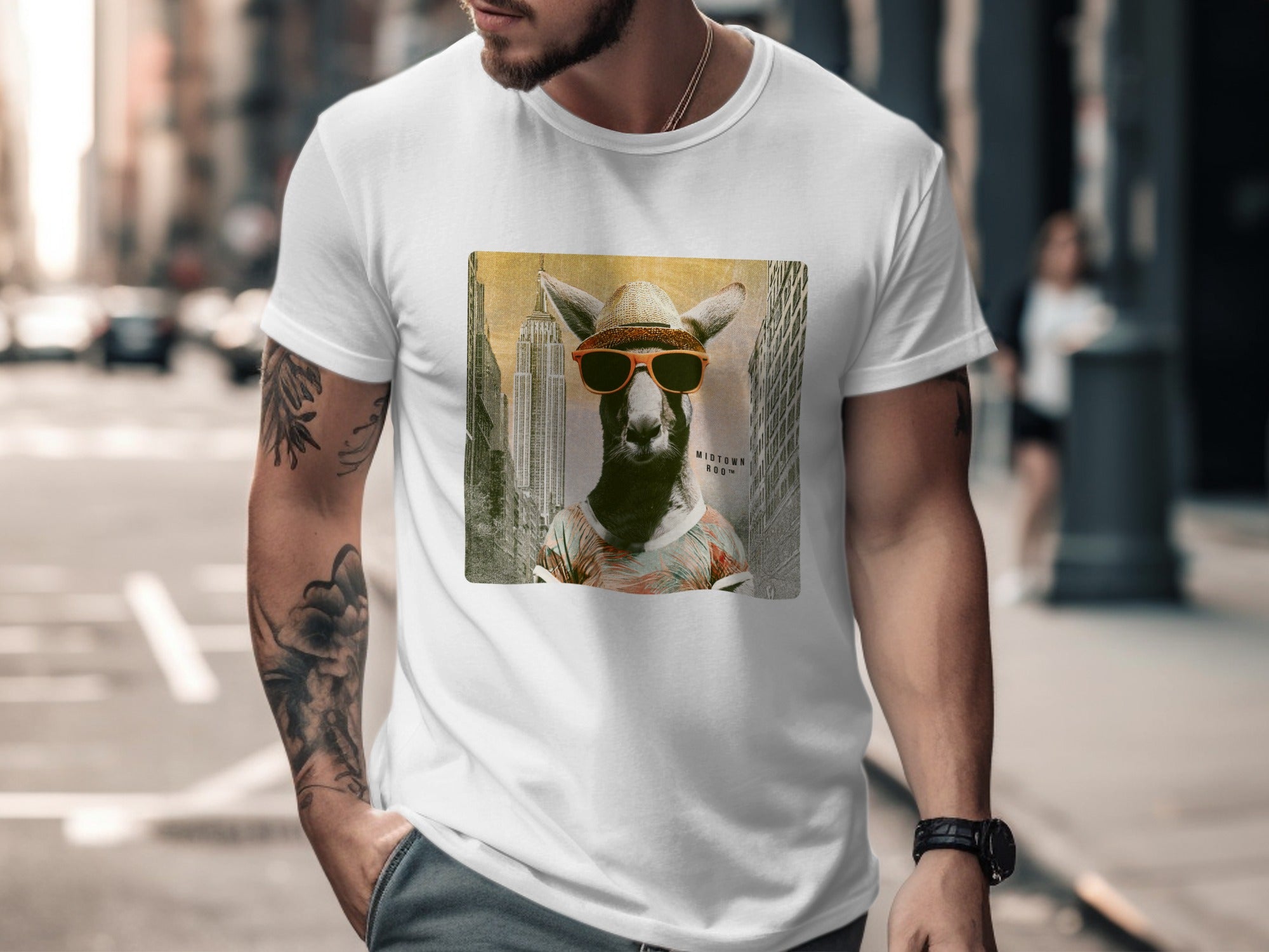 Kangaroo wearing sunglasses and a hat over a city background graphic on a white t-shirt.