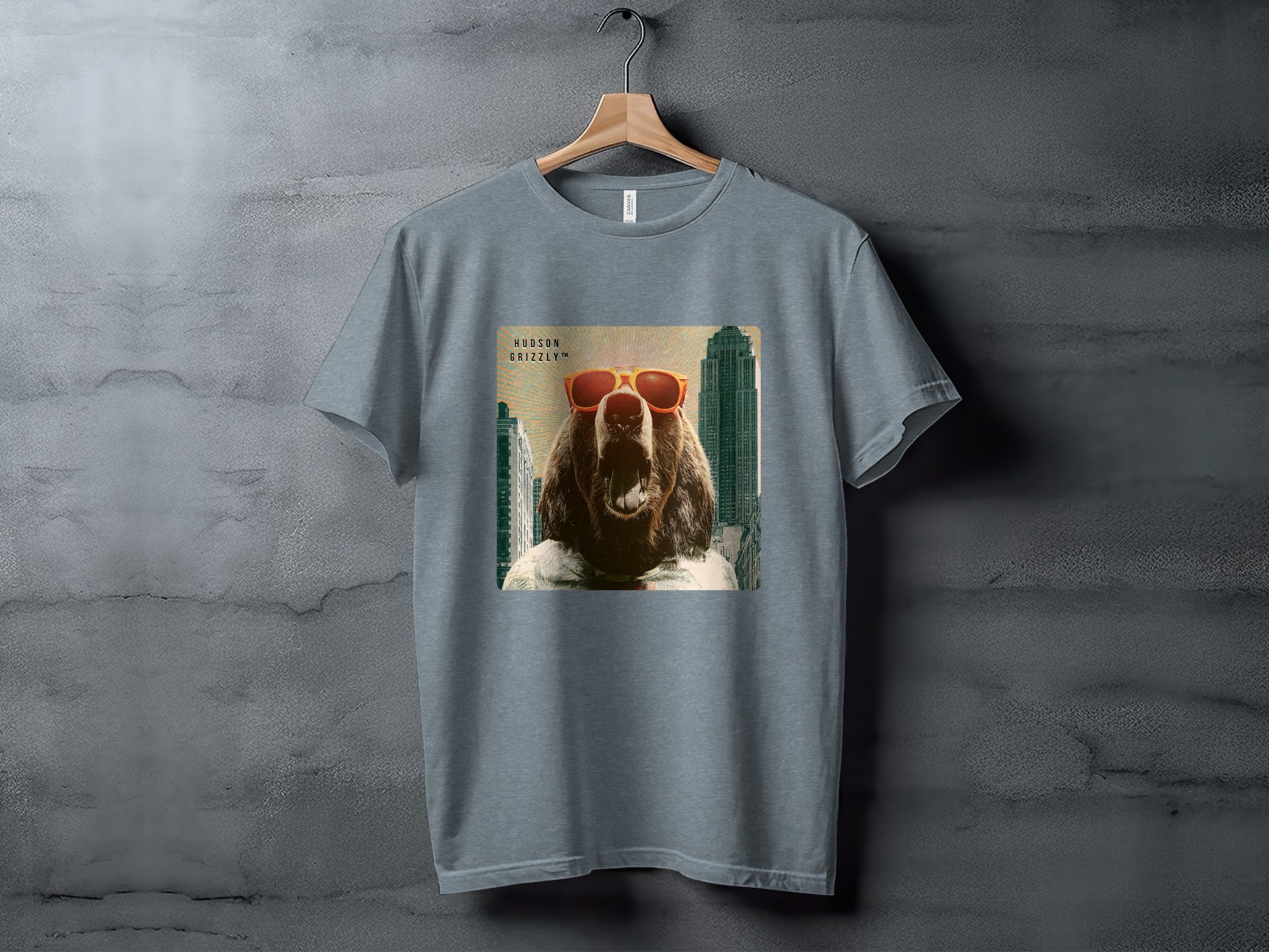 T-shirt with a grizzly bear wearing sunglasses against a city skyline.