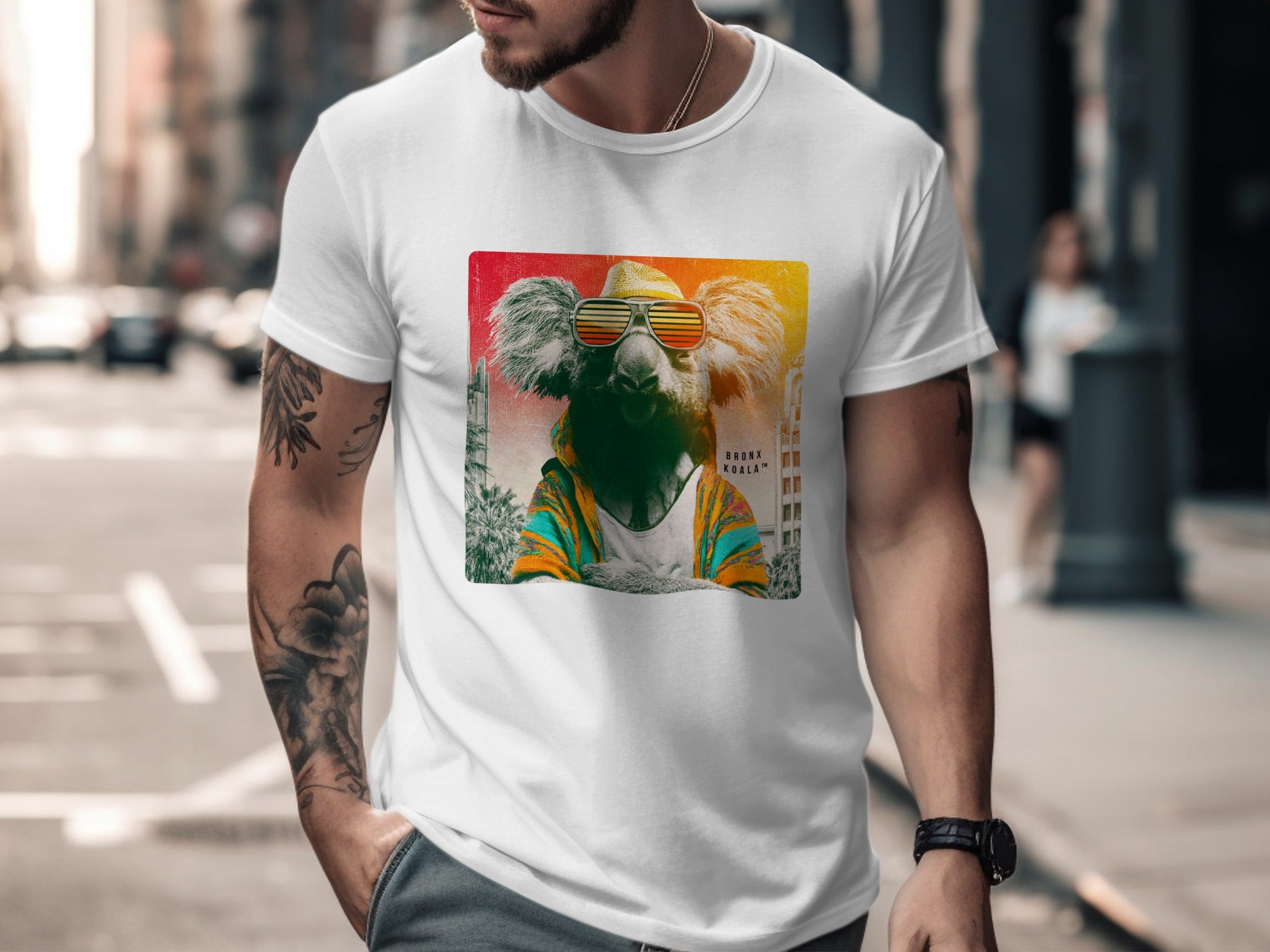 T-shirt with graphic of a koala wearing sunglasses and a colorful jacket.
