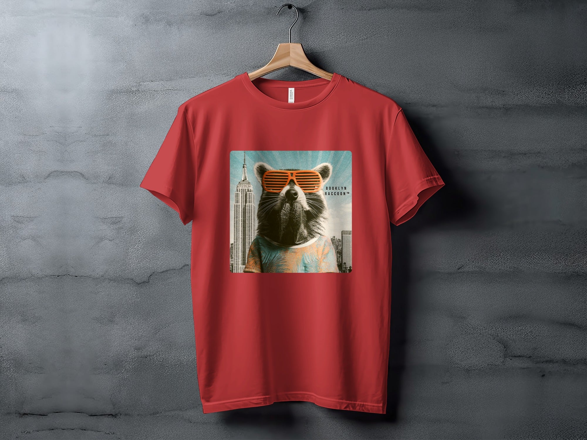 Red t-shirt with a cool raccoon wearing sunglasses and a Hawaiian shirt in front of Empire State Building.