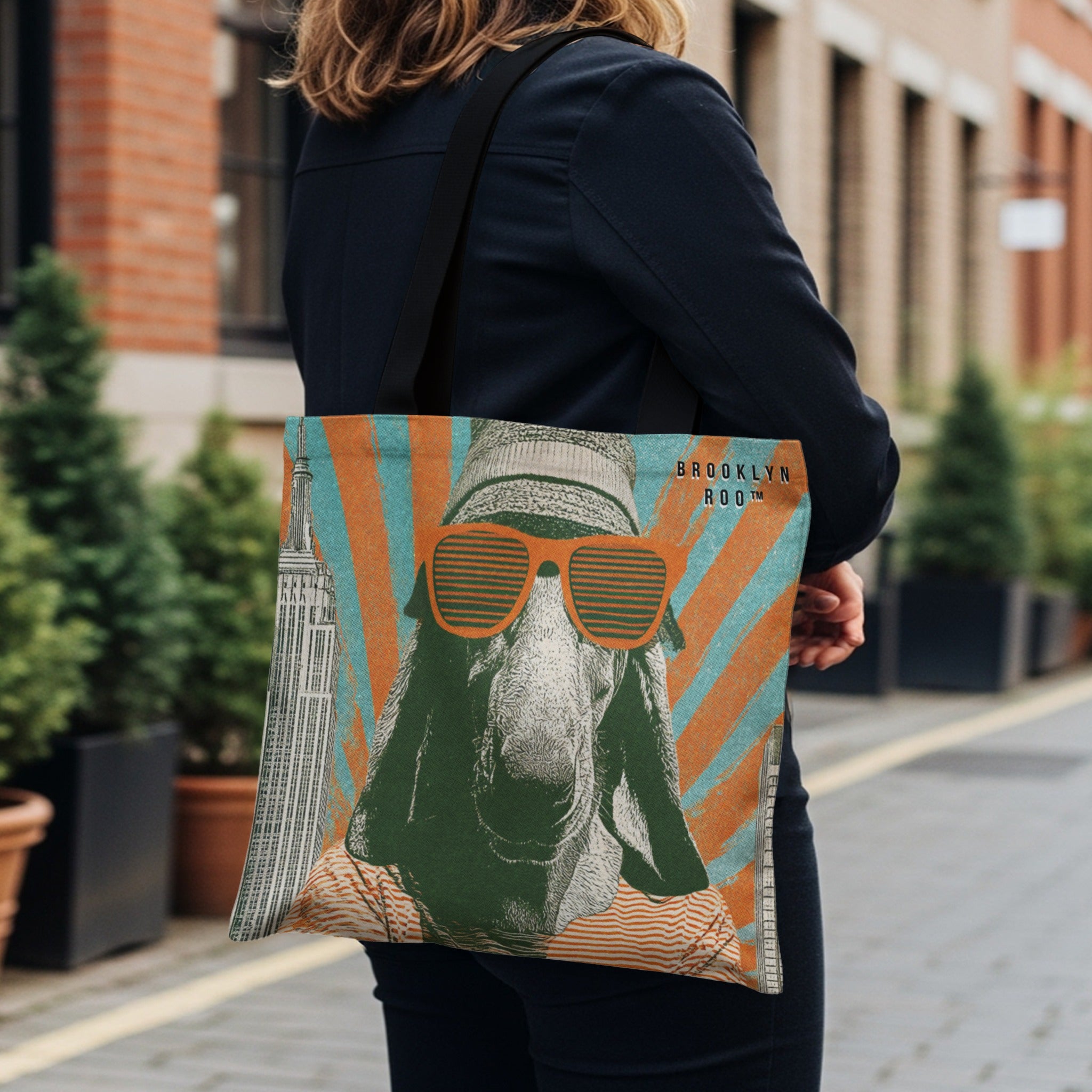 Tote bag with goat in sunglasses, hat, and shirt, featuring Empire State Building.