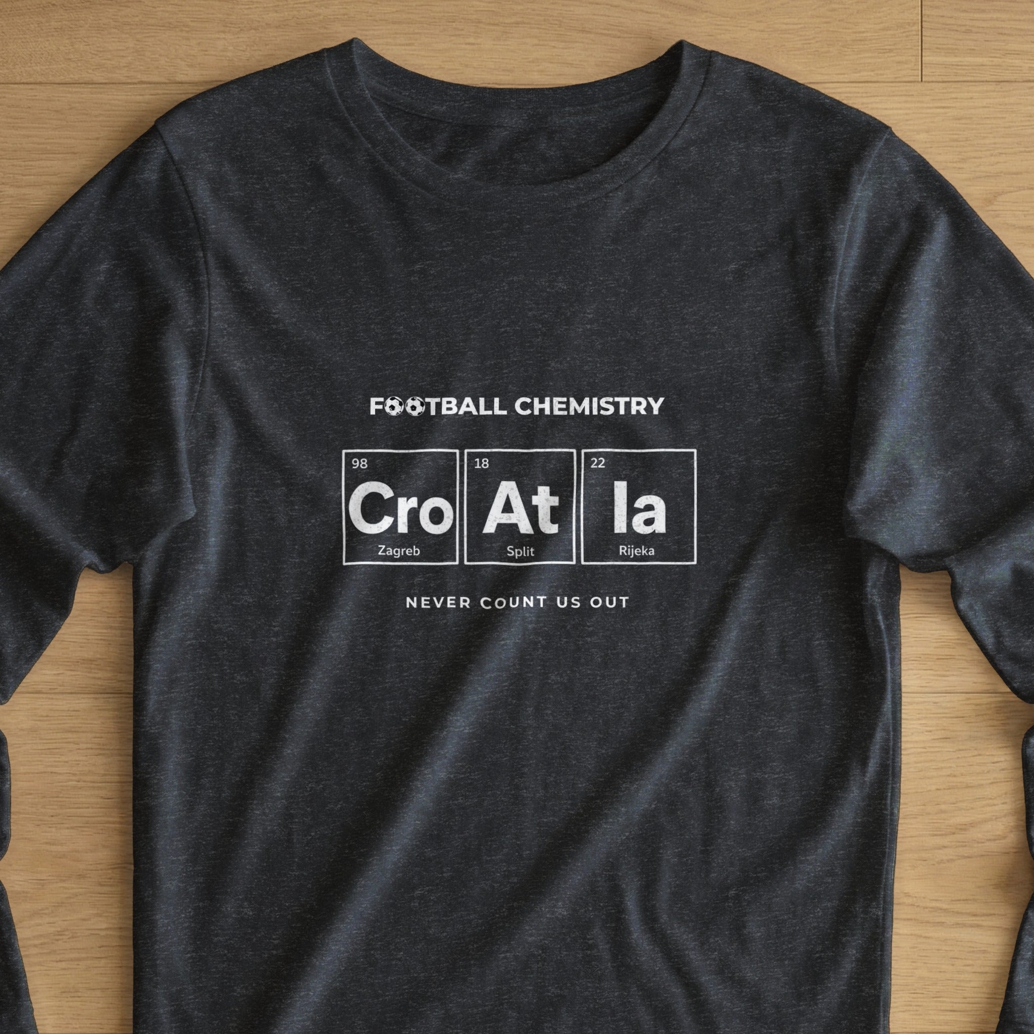 Dark t-shirt with "Football Chemistry Cro At la" and city names.
