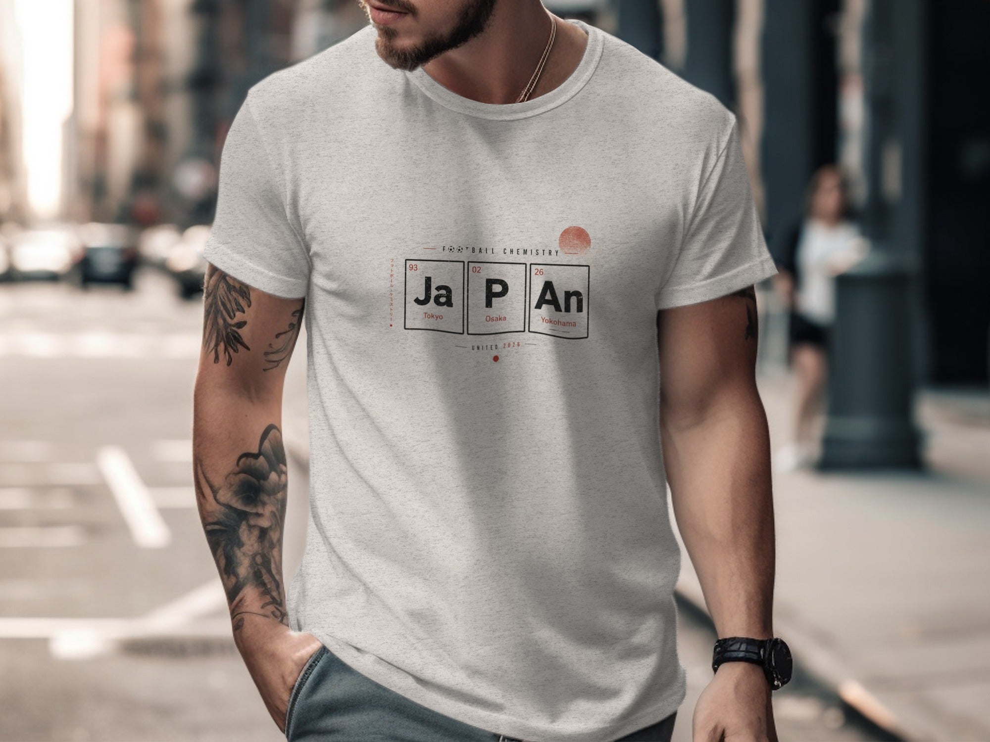 Grey t-shirt with "JAPAN" in periodic table elements and "UNITED 2020" below.