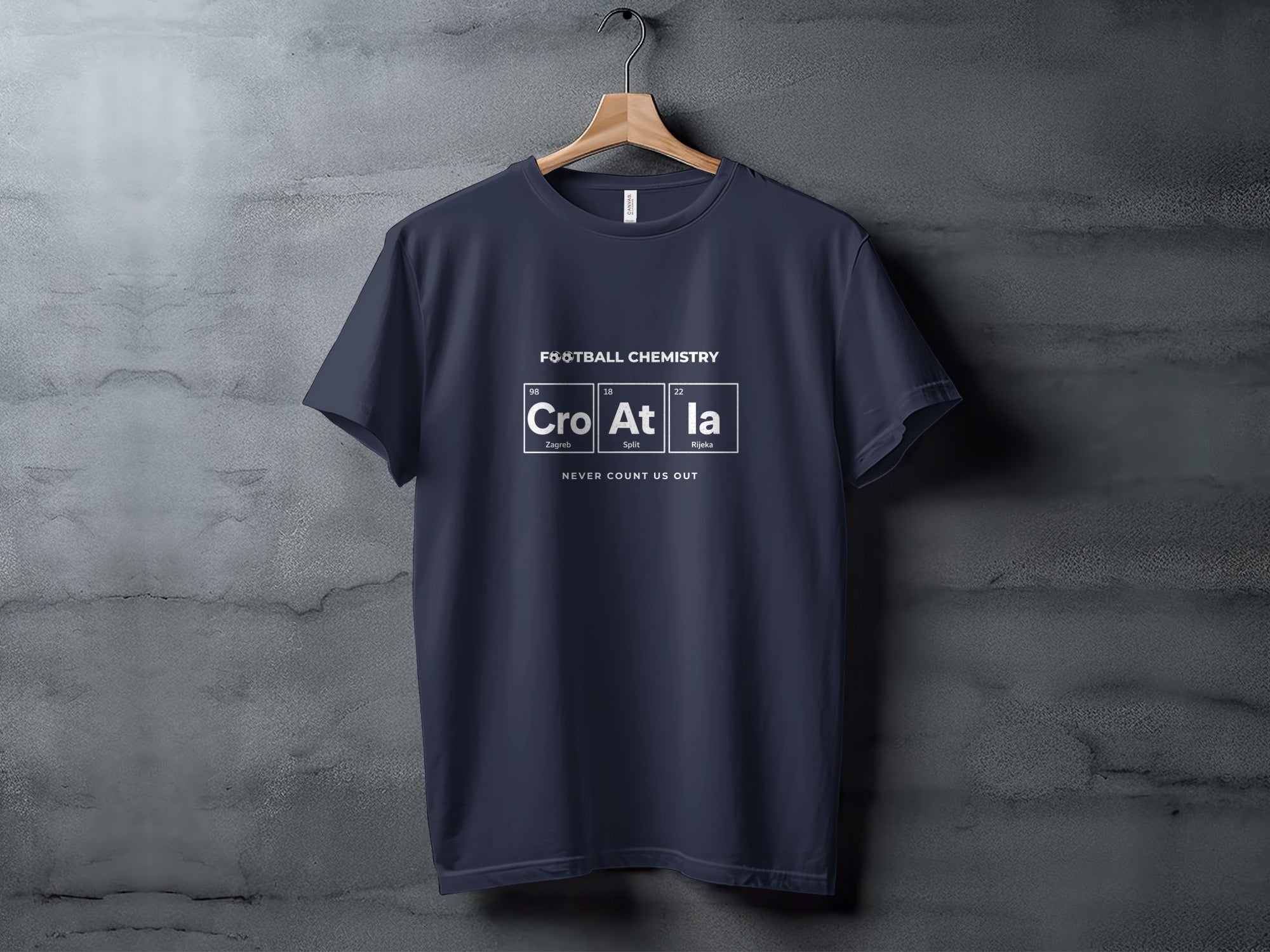 Dark blue t-shirt with "Football Chemistry" and Croatian city names in periodic table style.