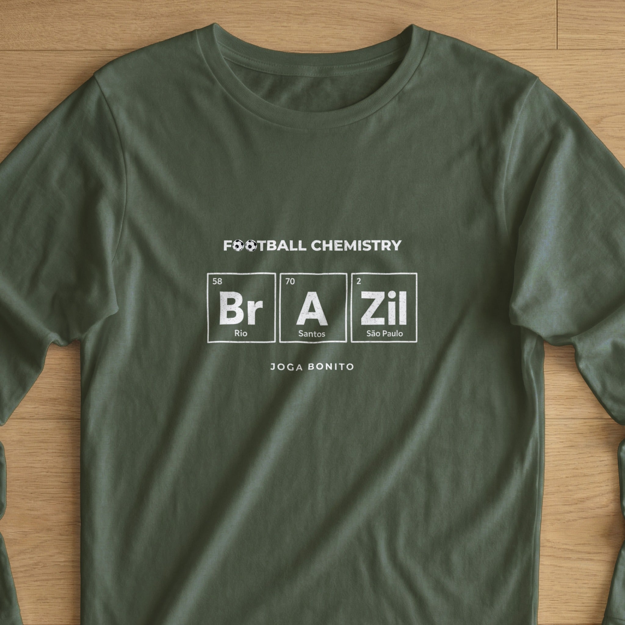 Dark green long-sleeve t-shirt with "FOOTBALL CHEMISTRY" and "BRA ZIL" in periodic table style.