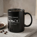 Black mug with "FOOTBALL CHEMISTRY" and periodic table elements for cities.