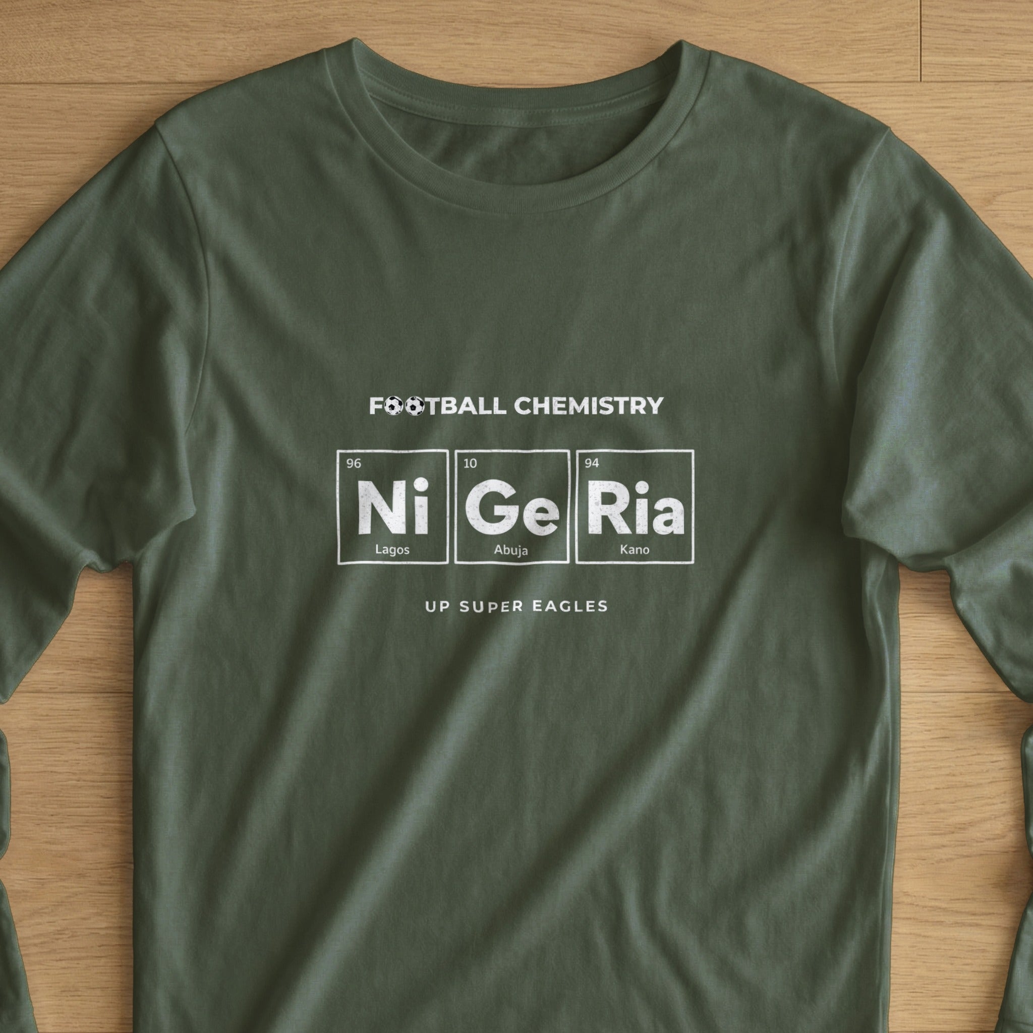 Green t-shirt with "Football Chemistry" and Nigerian cities in periodic table style.