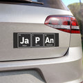 Car bumper sticker with periodic table elements spelling "JAPAN" and city names.