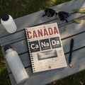Notebook cover with Canada map design, featuring city names and football field.