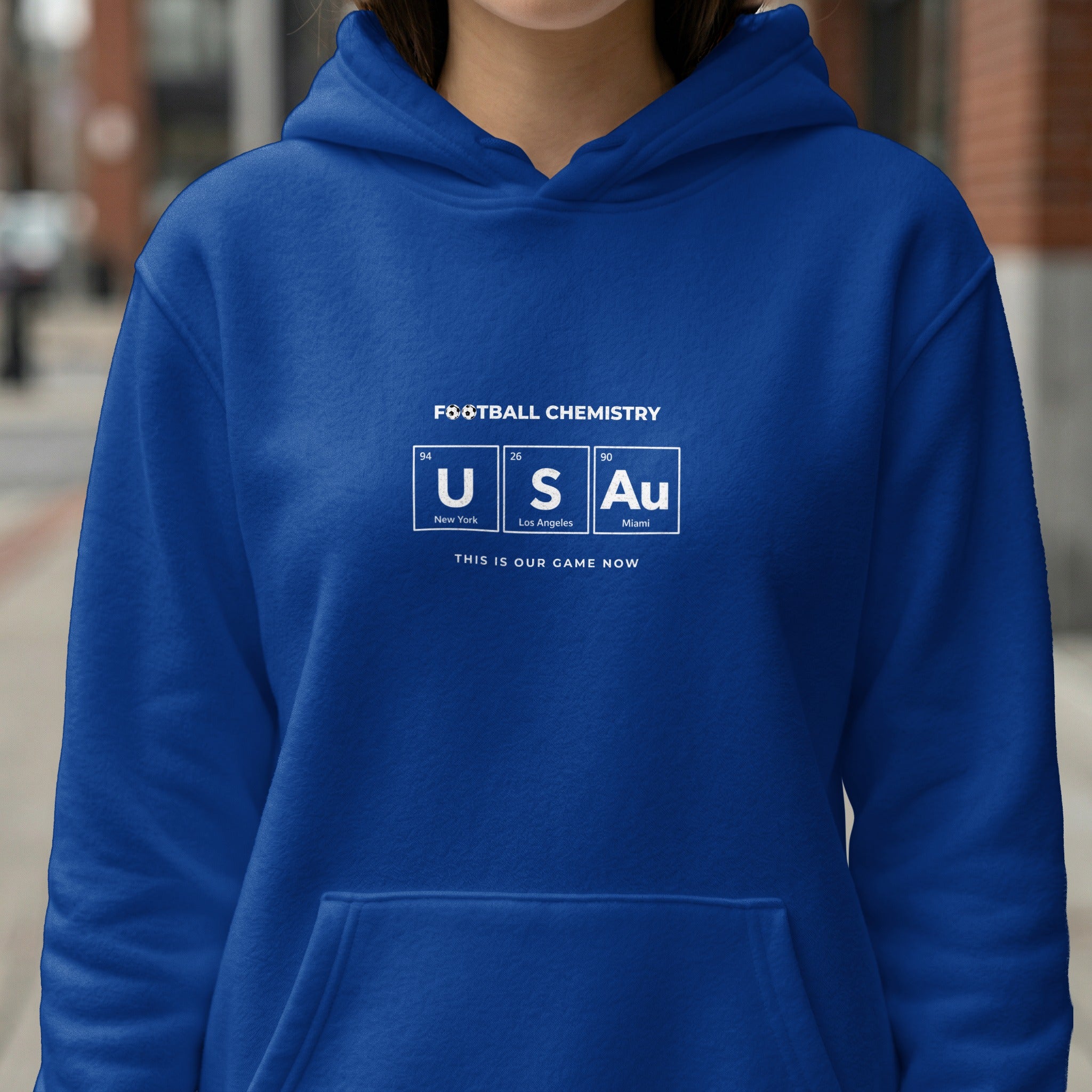 Blue hoodie with "Football Chemistry" text and US and Au symbols.