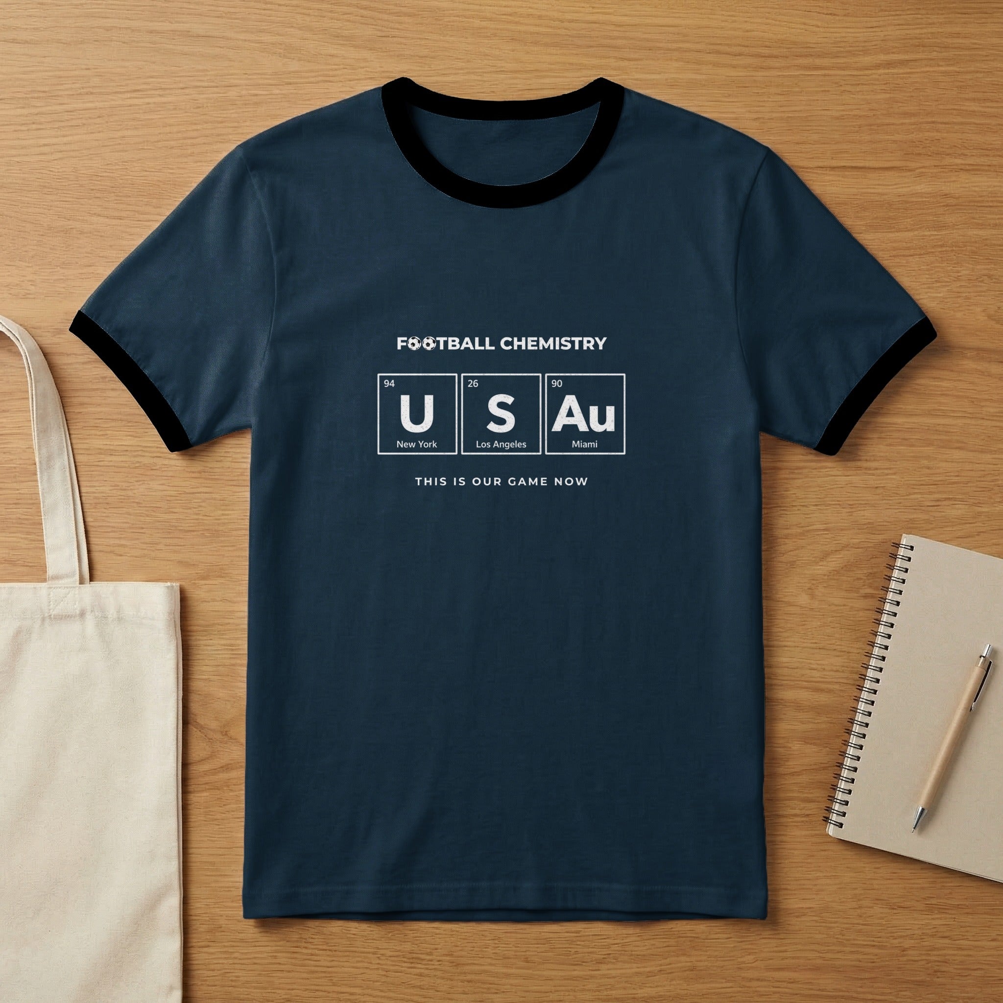 Navy t-shirt with "Football Chemistry" and "US Au" elements, and "This is our game now".