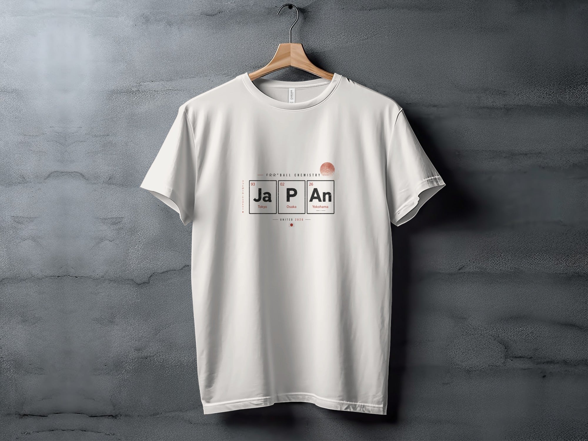 White t-shirt with "JAPAN" in periodic table style, "Football Chemistry" and "UNITED 2026".