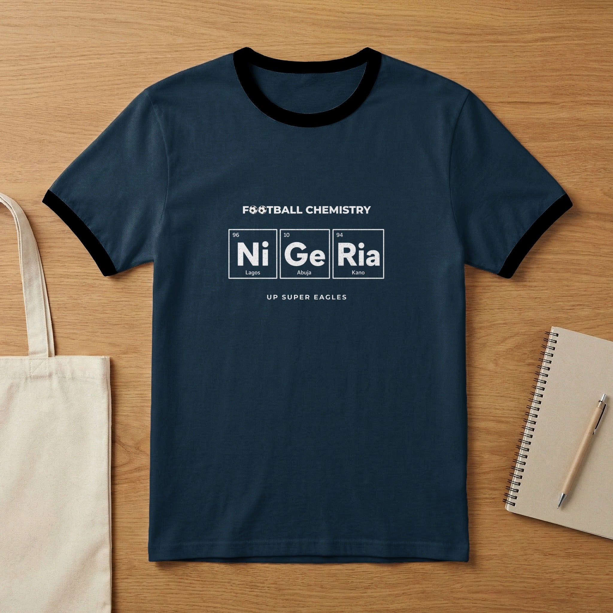 Navy ringer t-shirt with "FOOTBALL CHEMISTRY Ni Ge Ria" periodic table design.